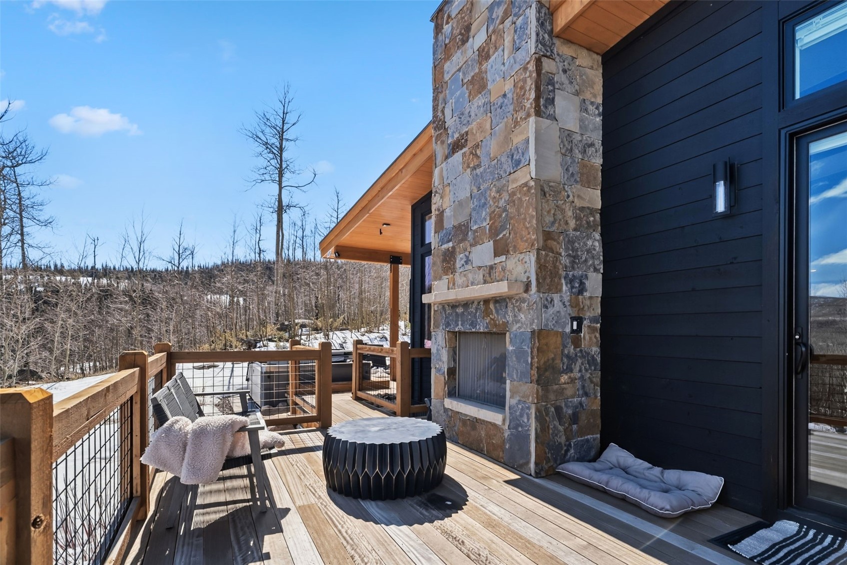 283 McKay Road Silverthorne, CO 80498 - Photo 28 of 47 Patio with outdoor fireplace backing to National Forest.