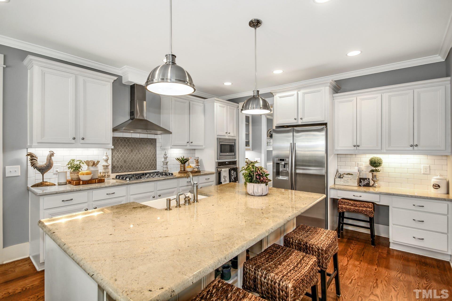 948 Flash Drive Rolesville, NC 27571 - Photo 12 of 30 a kitchen with kitchen island a counter top space appliances and cabinets