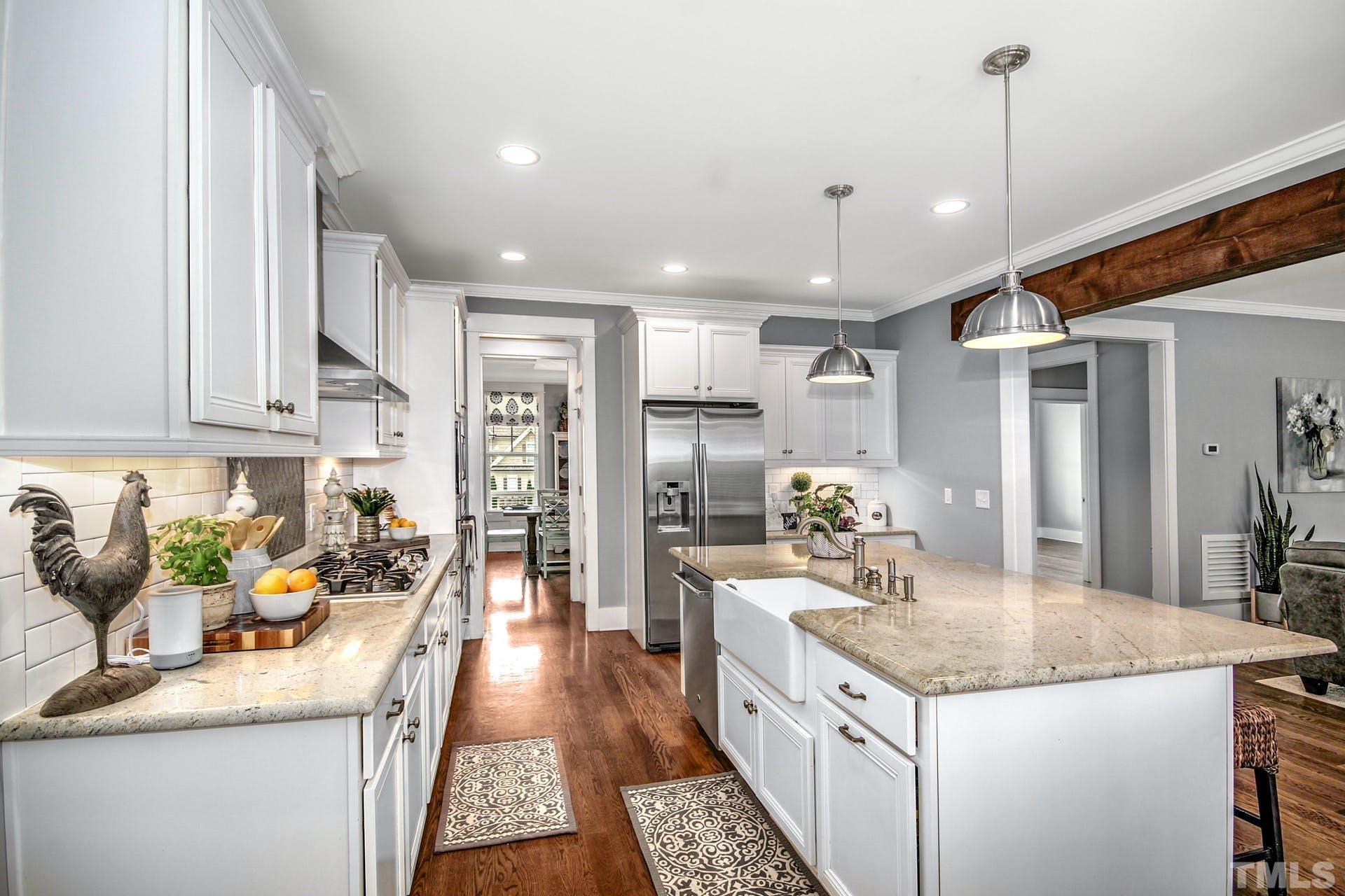 948 Flash Drive Rolesville, NC 27571 - Photo 13 of 30 a kitchen with granite countertop a sink and refrigerator