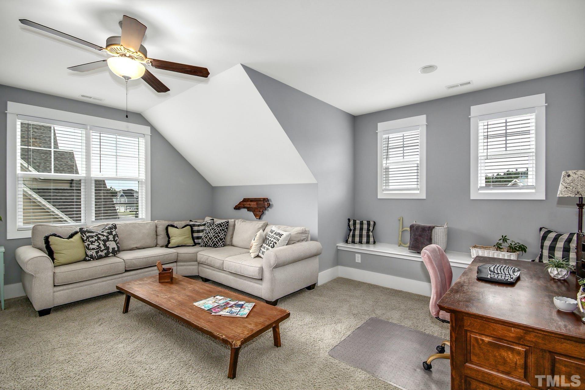 948 Flash Drive Rolesville, NC 27571 - Photo 19 of 30 a living room with furniture a table and a large window