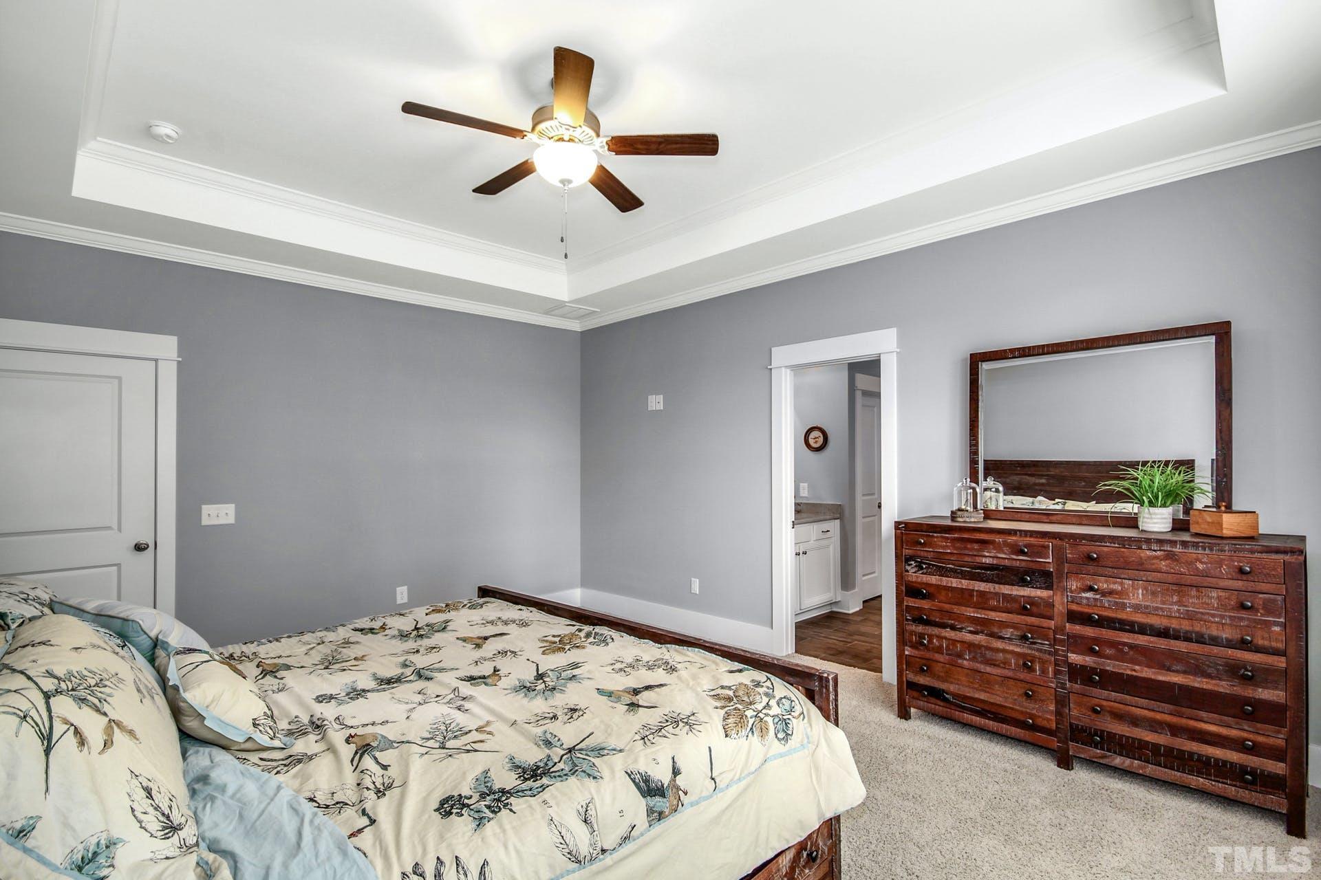 948 Flash Drive Rolesville, NC 27571 - Photo 21 of 30 a bedroom with a bed and a flat screen tv