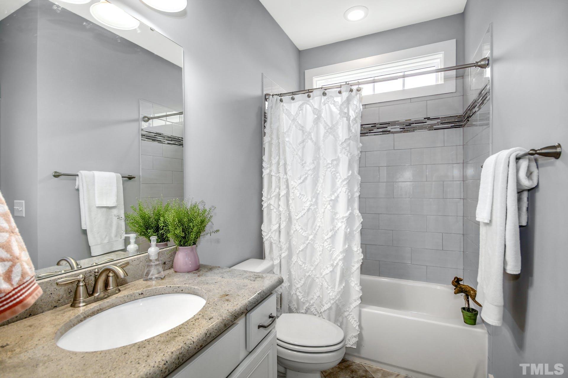 948 Flash Drive Rolesville, NC 27571 - Photo 22 of 30 a bathroom with a granite countertop sink toilet and shower