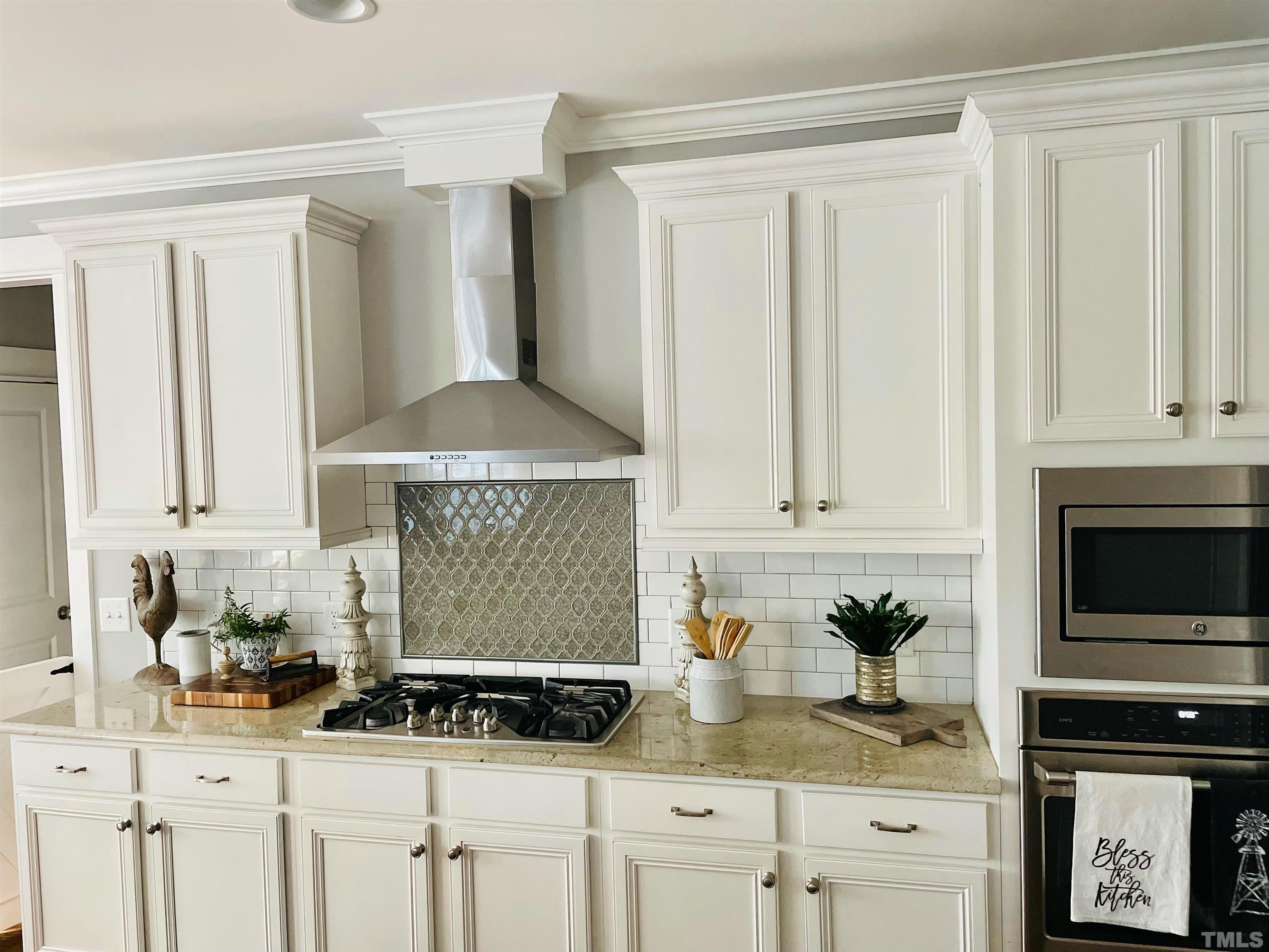 948 Flash Drive Rolesville, NC 27571 - Photo 5 of 30 a kitchen with granite countertop a sink a stove and cabinets