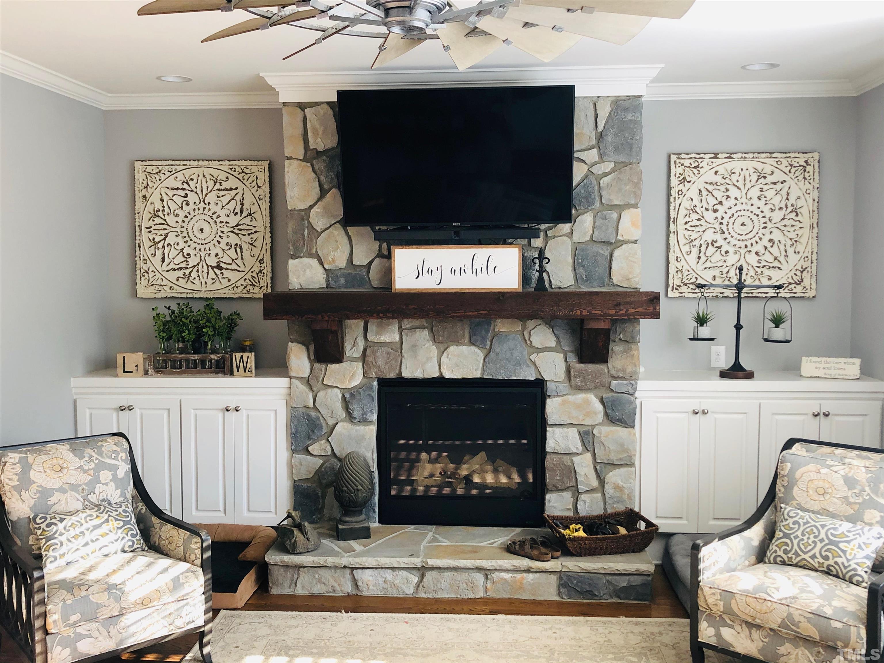 948 Flash Drive Rolesville, NC 27571 - Photo 6 of 30 a living room with furniture a flat screen tv and a fireplace