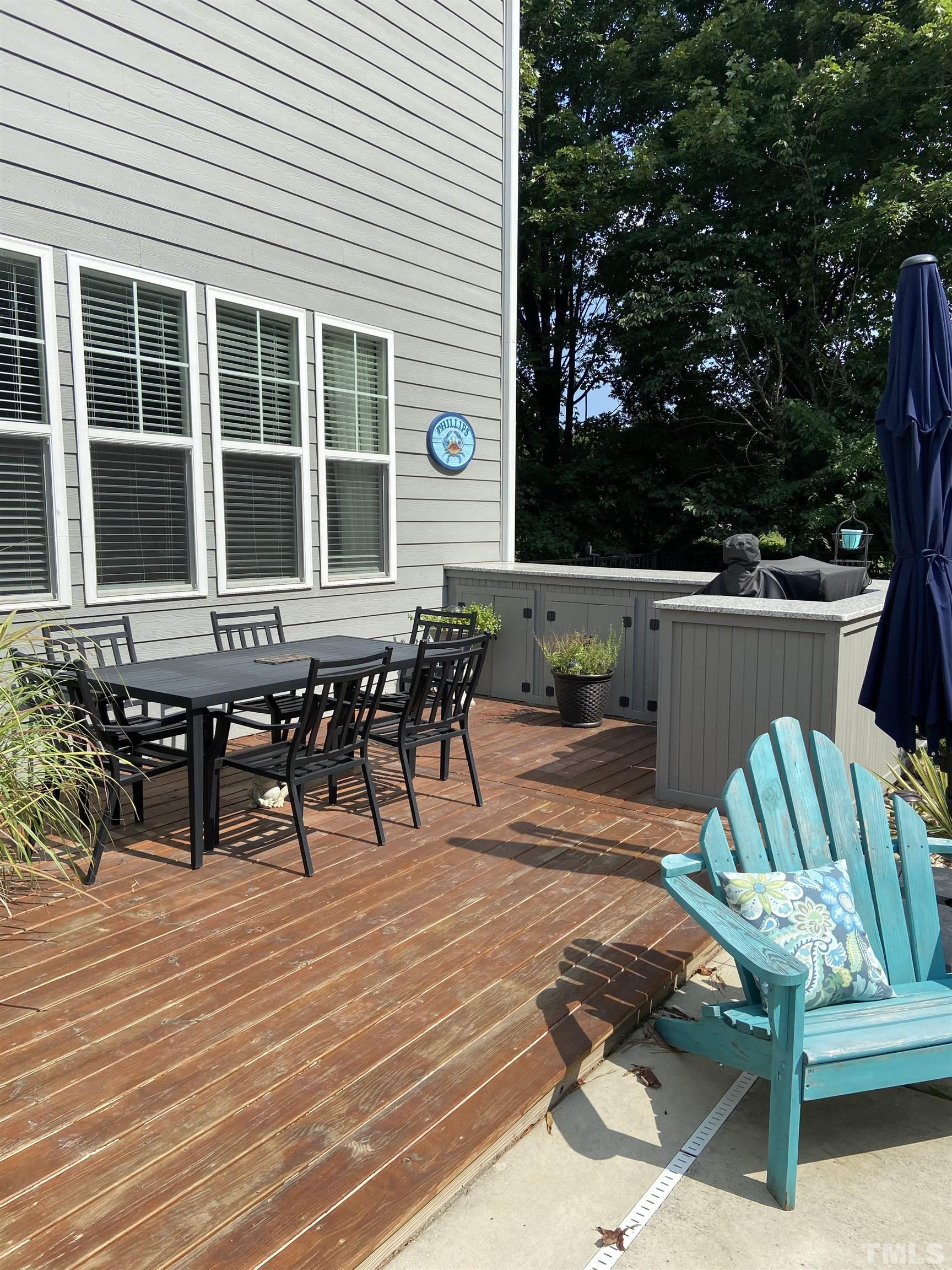948 Flash Drive Rolesville, NC 27571 - Photo 8 of 30 a view of a dinning table and chairs in the patio