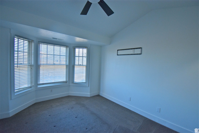 2480 West 450 South, Unit 2 Springville, UT 84663 - Photo 10 of 19 Bedroom featuring lofted ceiling, dark colored carpet, and ceiling fan