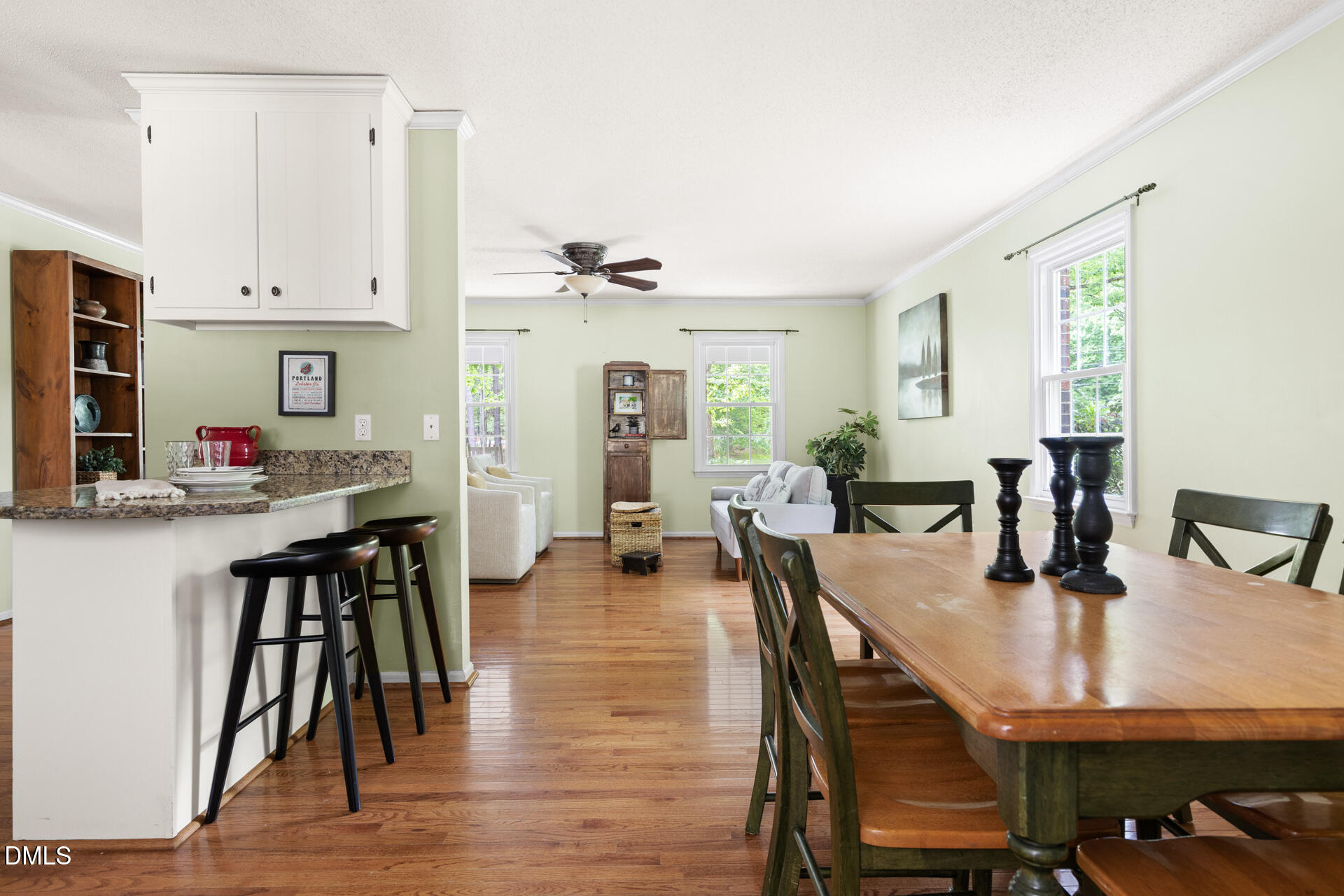 1322 Palmers Grove Church Road Hillsborough, NC 27278 - Photo 10 of 36 a dining room with kitchen island a table and chairs in it
