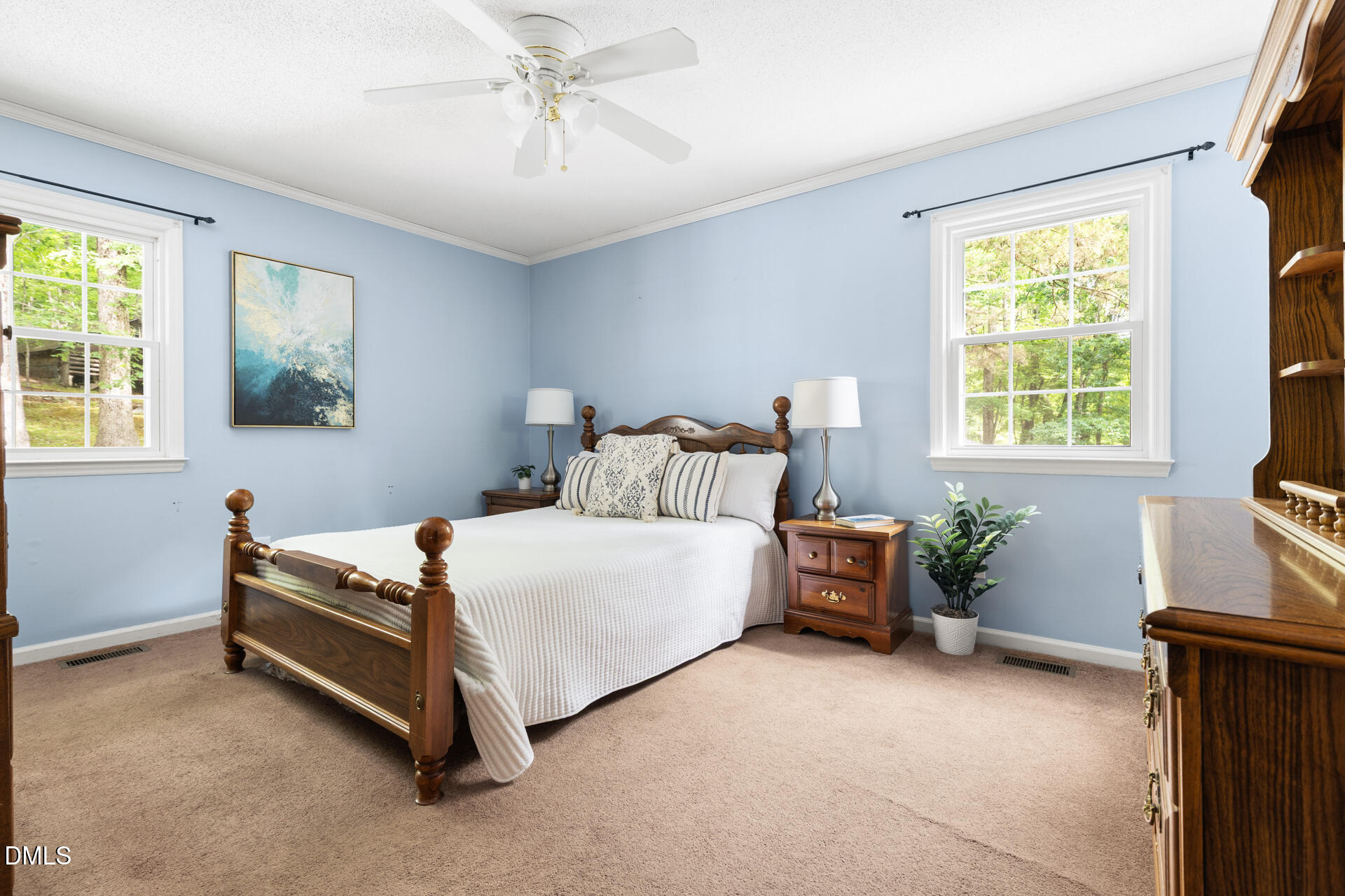 1322 Palmers Grove Church Road Hillsborough, NC 27278 - Photo 18 of 36 a bedroom with a bed and a chandelier