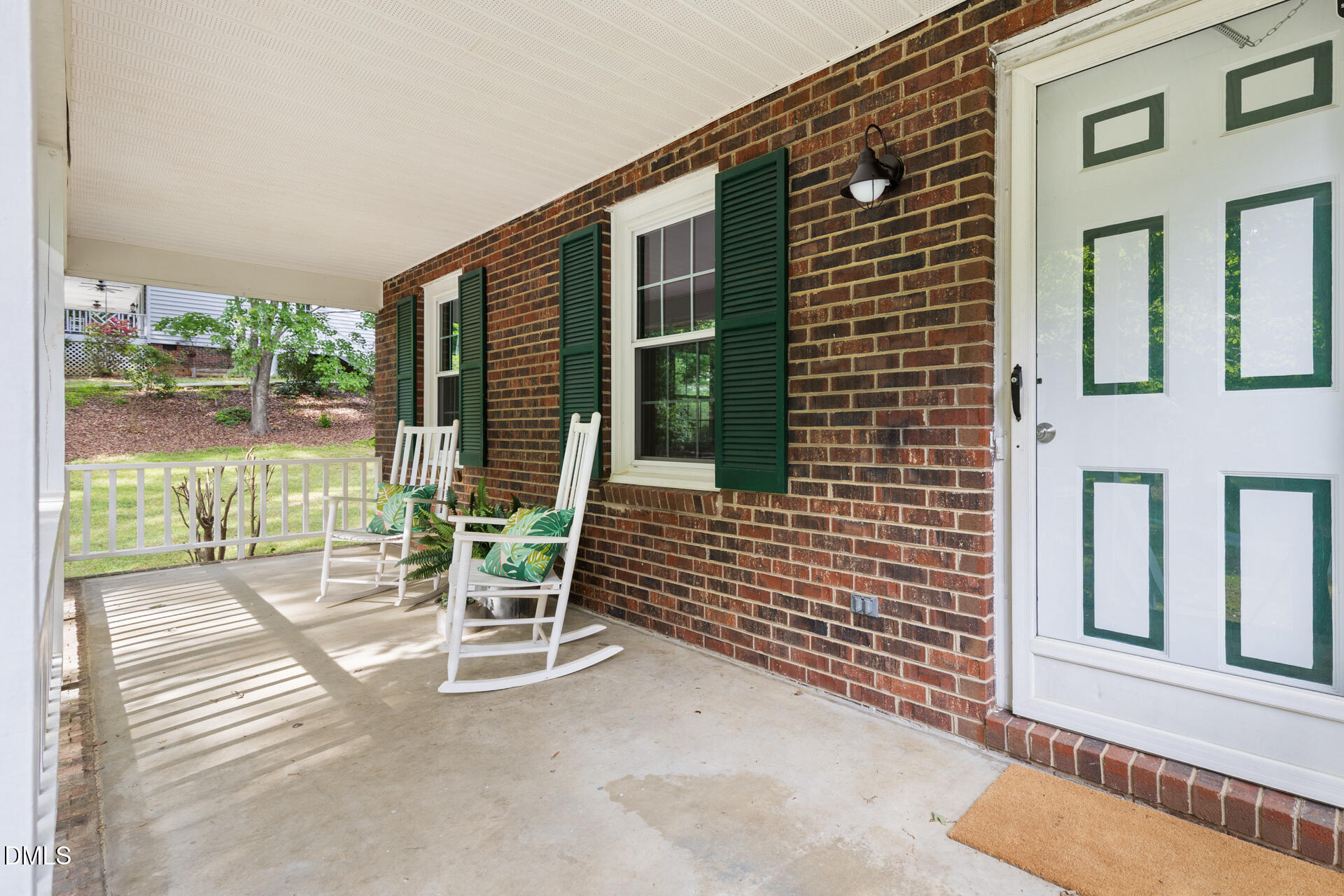 1322 Palmers Grove Church Road Hillsborough, NC 27278 - Photo 2 of 36 a balcony with table and chairs