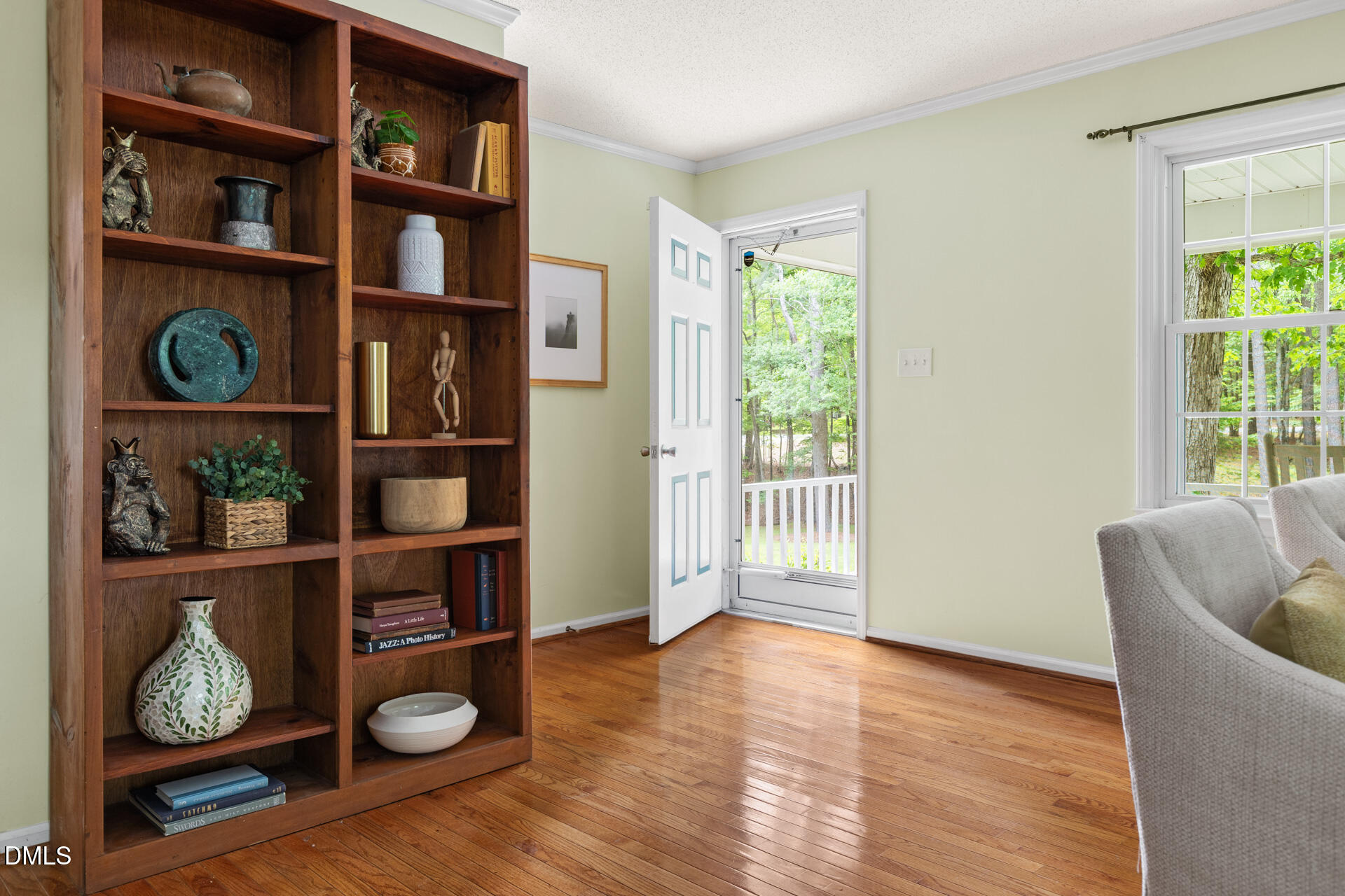 1322 Palmers Grove Church Road Hillsborough, NC 27278 - Photo 4 of 36 a living room with furniture and a book shelf
