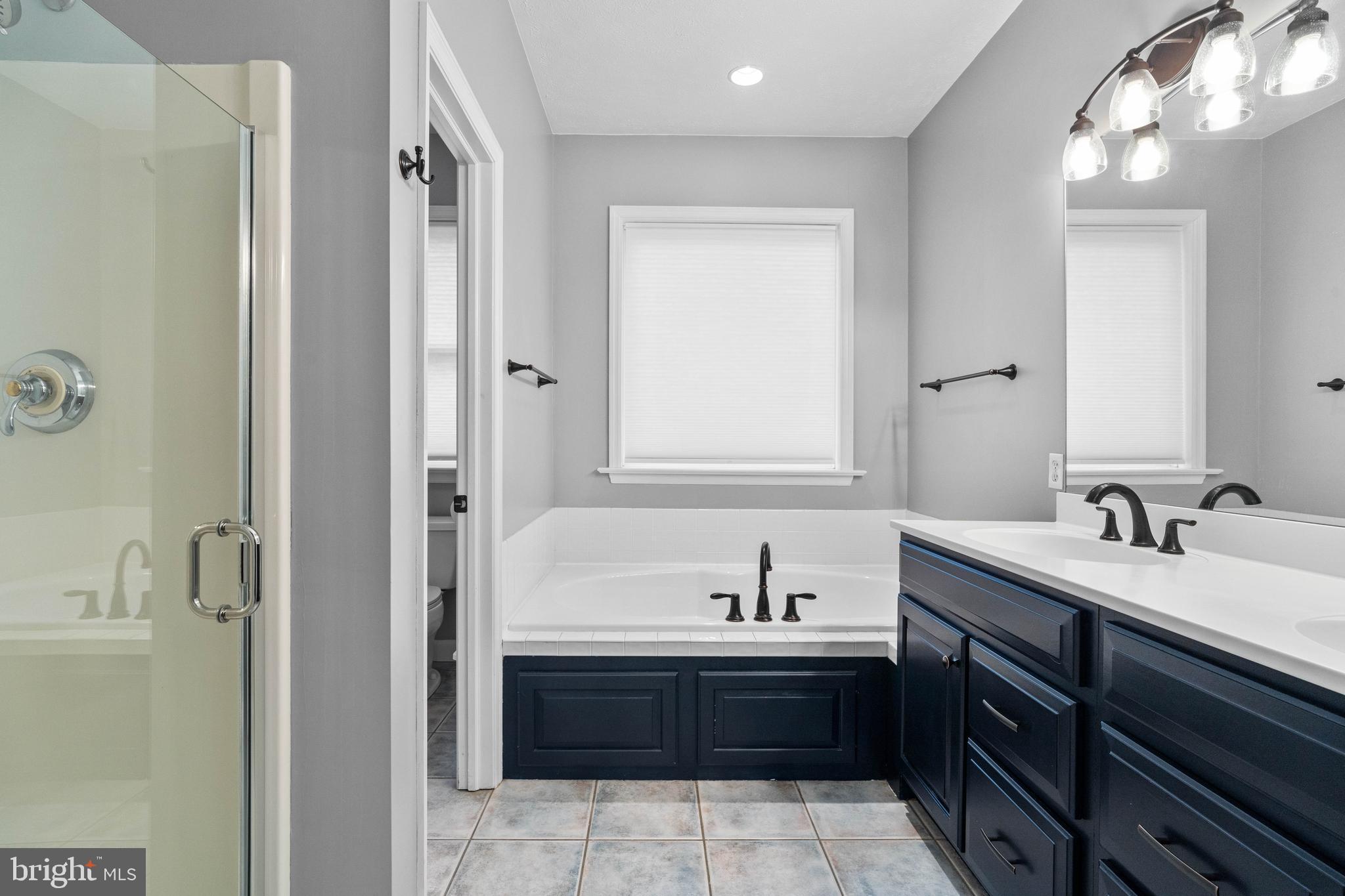 190 Michael Road Port Matilda, PA 16870 - Photo 15 of 59 a bathroom with a tub sink and mirror