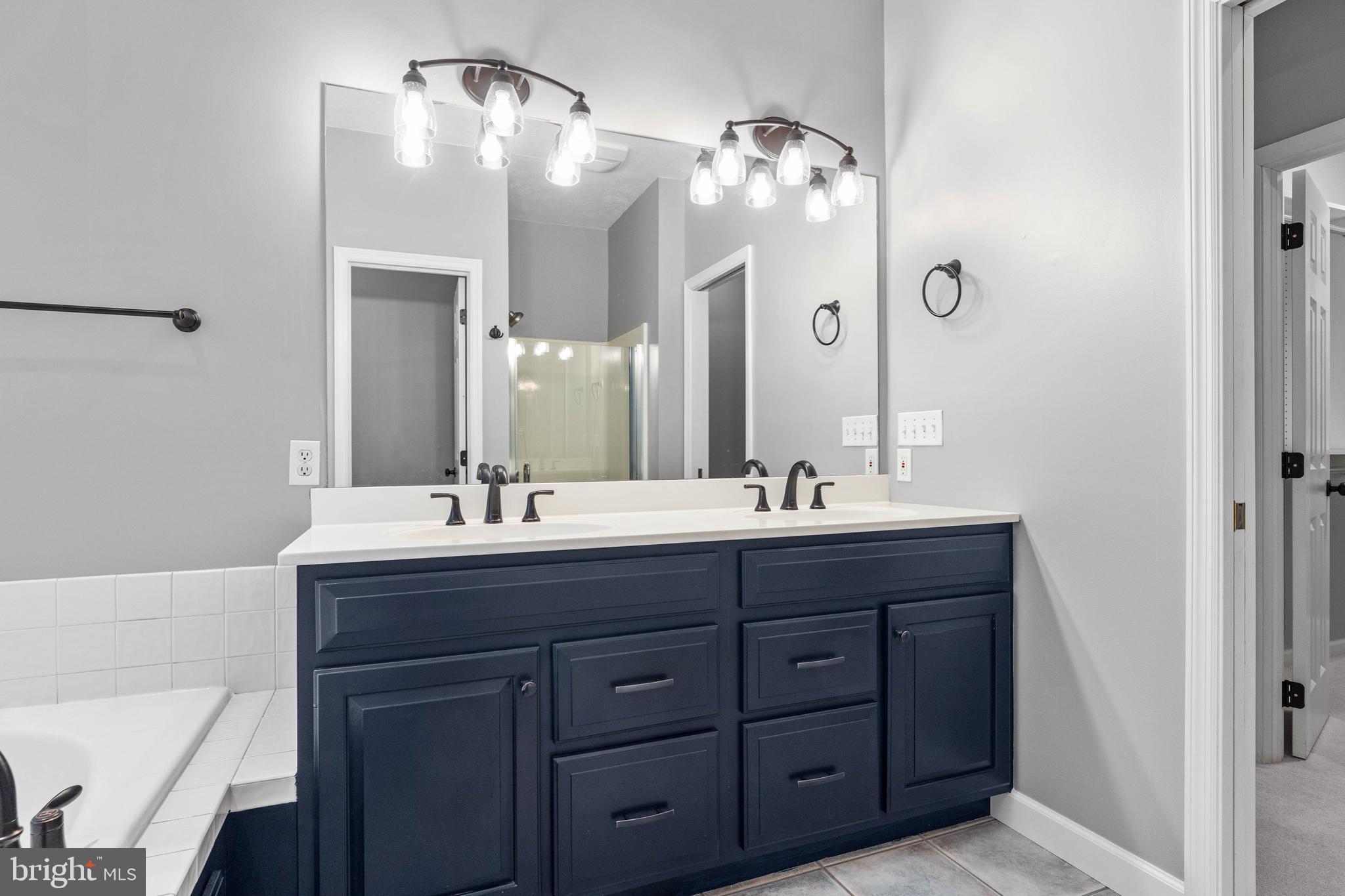 190 Michael Road Port Matilda, PA 16870 - Photo 16 of 59 a bathroom with double vanity sinks and a mirror