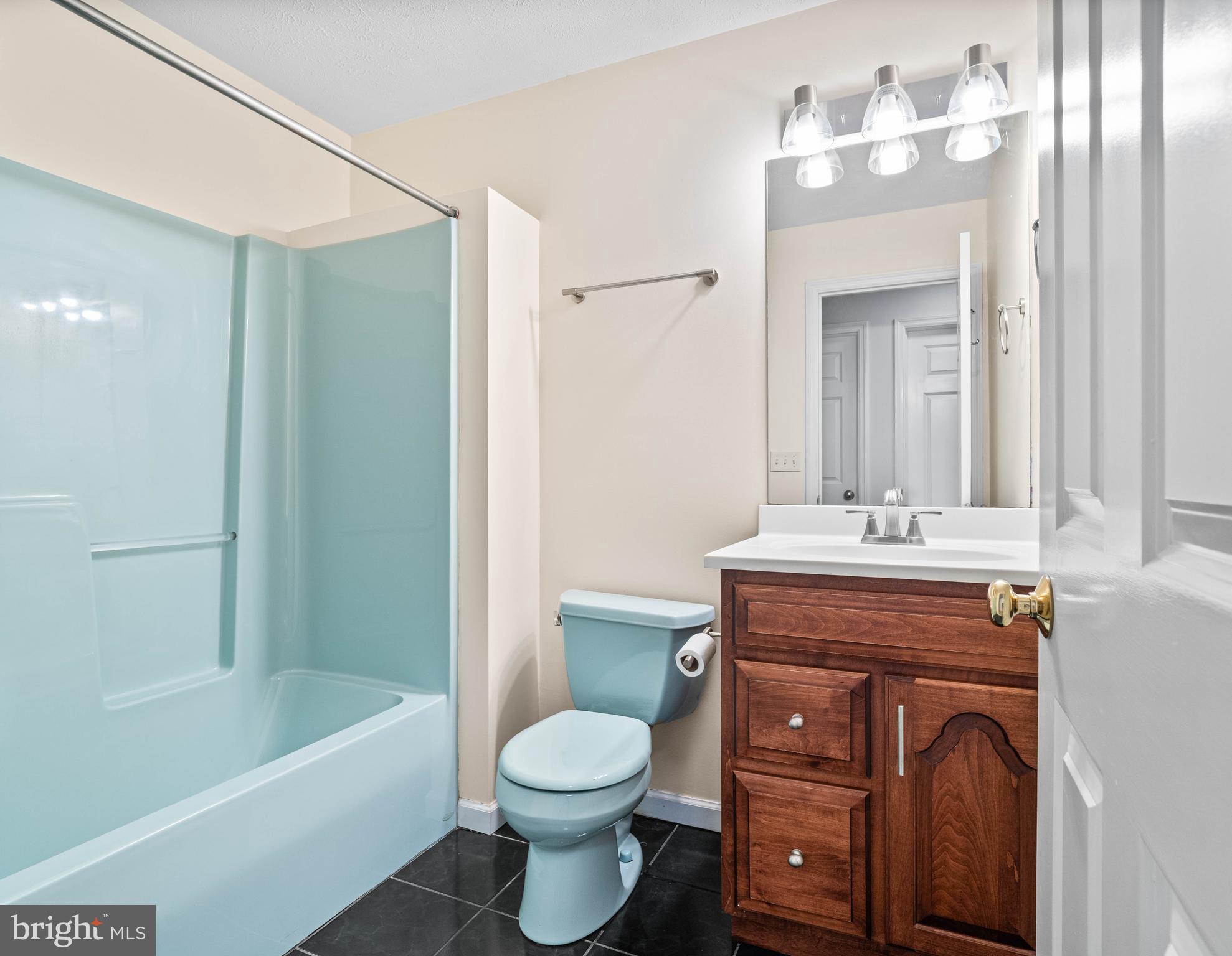 190 Michael Road Port Matilda, PA 16870 - Photo 35 of 59 a bathroom with a toilet a sink a tub and mirror