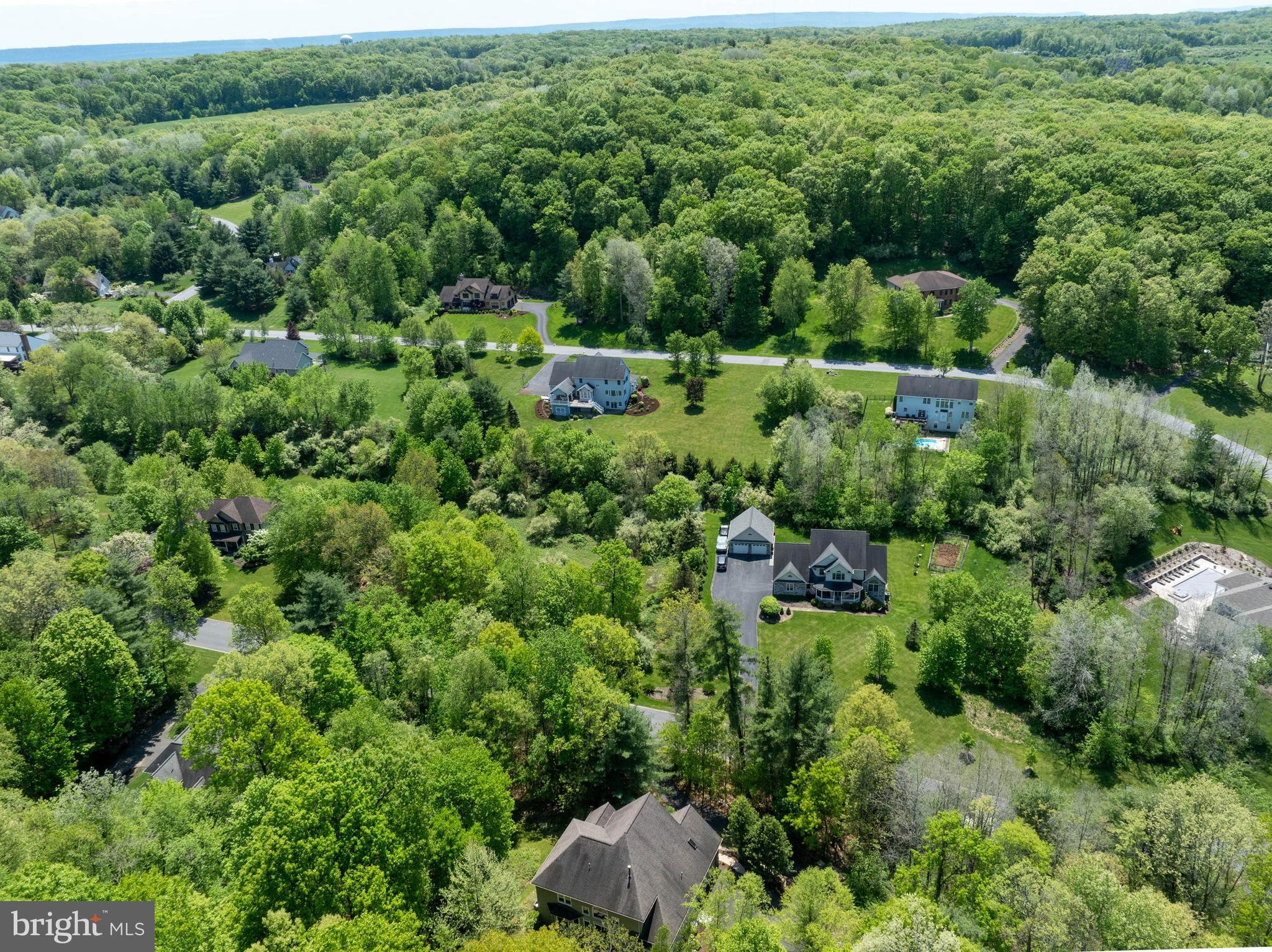 190 Michael Road Port Matilda, PA 16870 - Photo 55 of 59 an aerial view of a house with a lush green forest