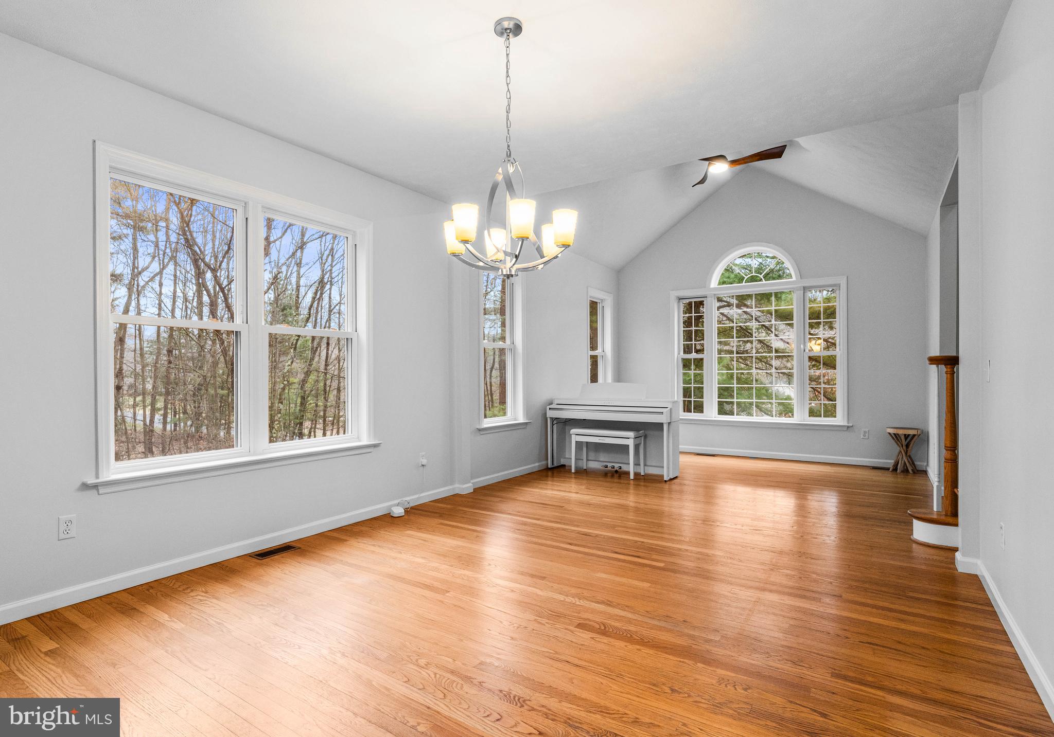 190 Michael Road Port Matilda, PA 16870 - Photo 6 of 59 an empty room with wooden floor chandelier and windows