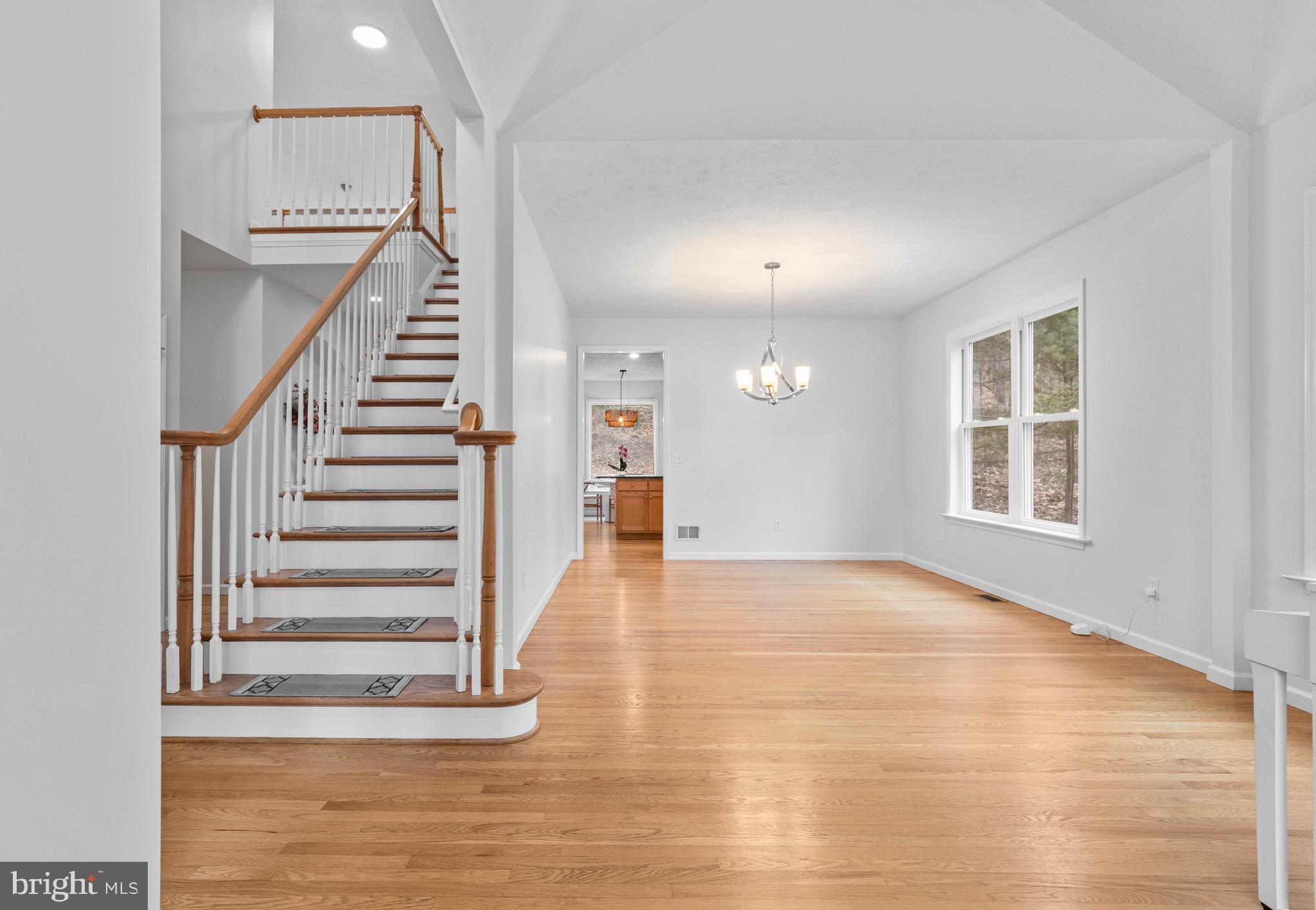 190 Michael Road Port Matilda, PA 16870 - Photo 9 of 59 a view of an empty room with wooden floor and stairs