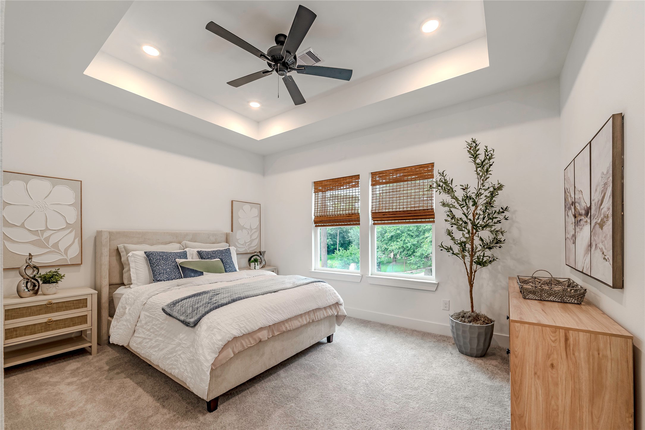 9527-9529 Beckley Street Houston, TX 77088 - Photo 11 of 14 a bedroom with a bed a chandelier and a window