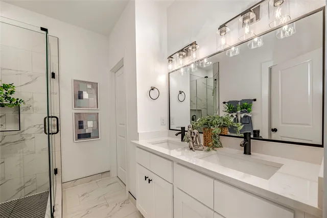 a bathroom with a sink and mirror