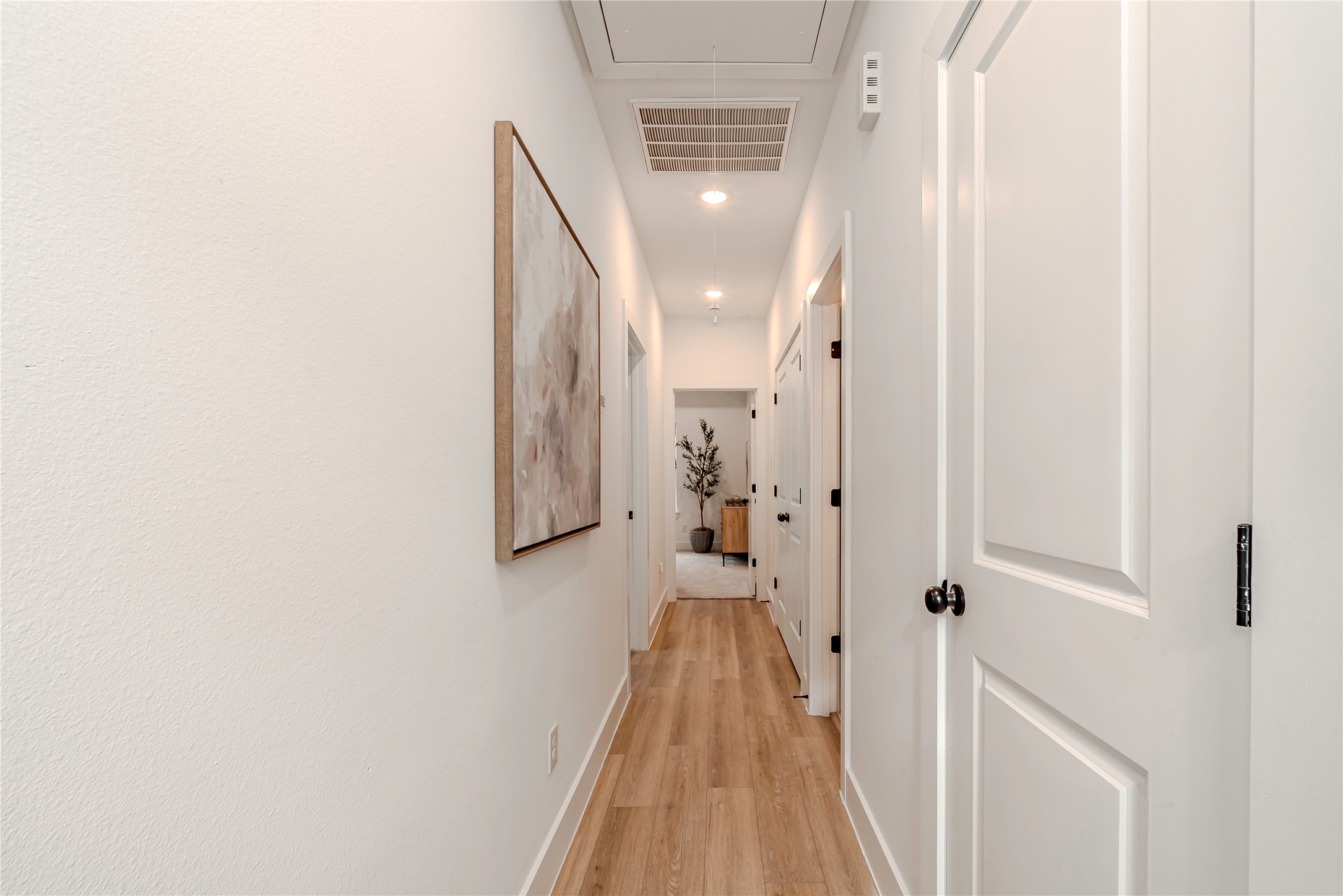 9527-9529 Beckley Street Houston, TX 77088 - Photo 8 of 14 a view of a hallway with wooden floor and staircase