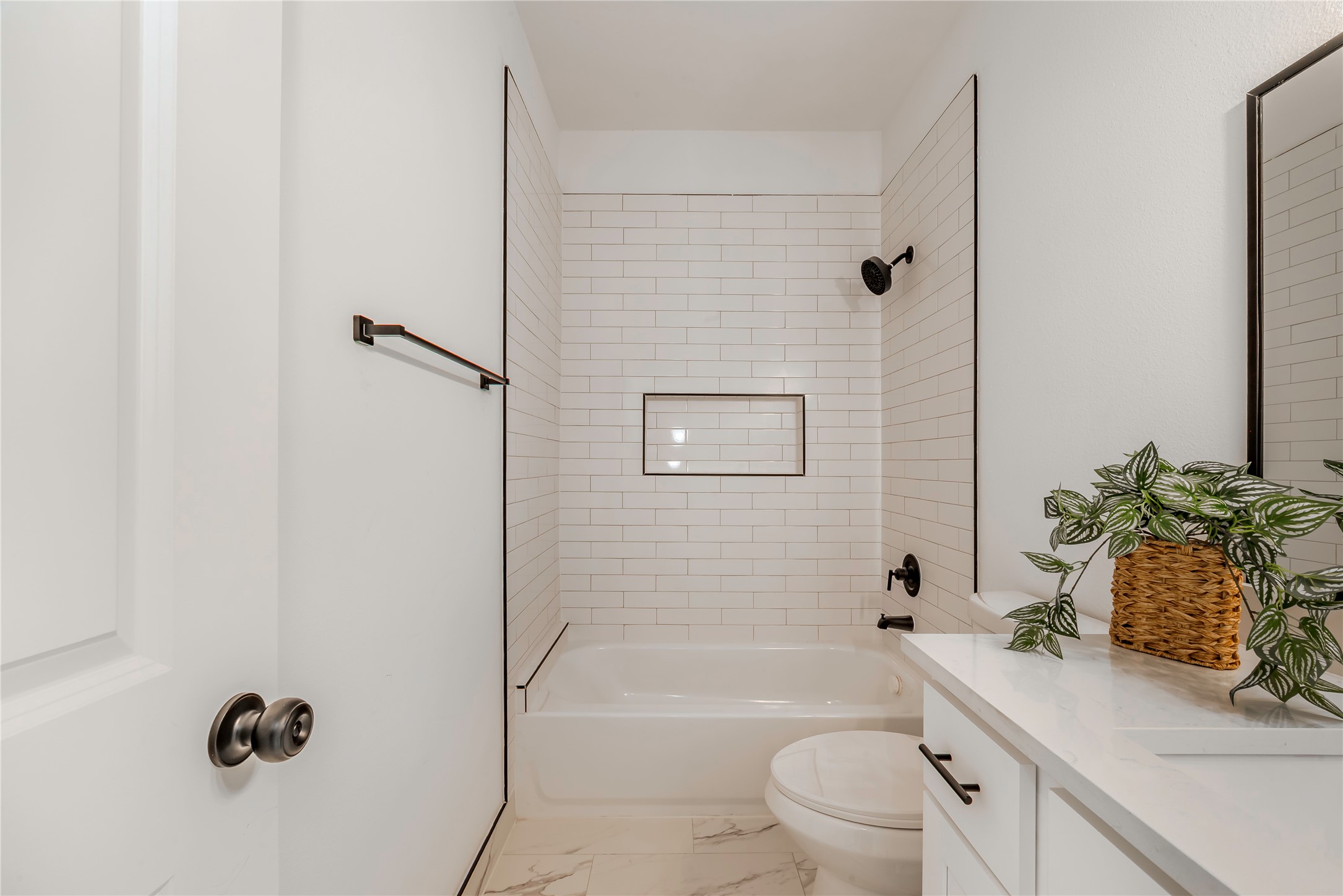 9527-9529 Beckley Street Houston, TX 77088 - Photo 9 of 14 a bathroom with a sink a toilet a tub and shower