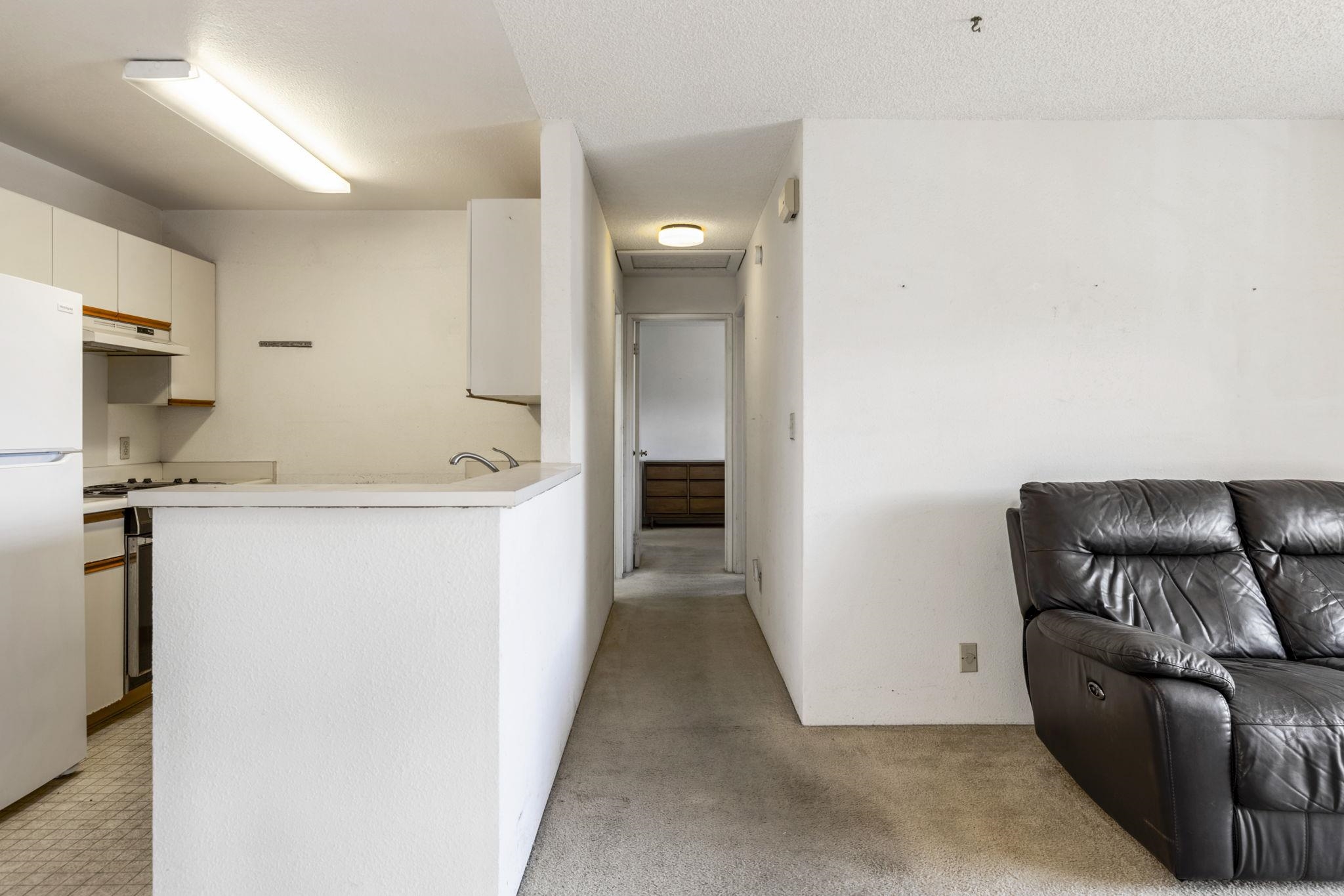 140 Uwapo Road, Unit 18203 Kihei, HI 96753 - Photo 25 of 40 a view of a kitchen with furniture and a refrigerator