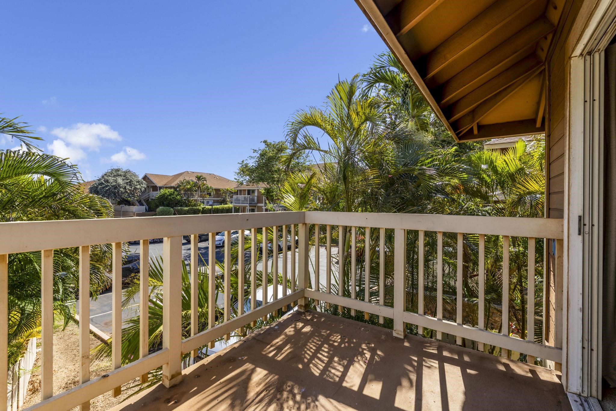140 Uwapo Road, Unit 18203 Kihei, HI 96753 - Photo 29 of 40 a view of a balcony with wooden floor