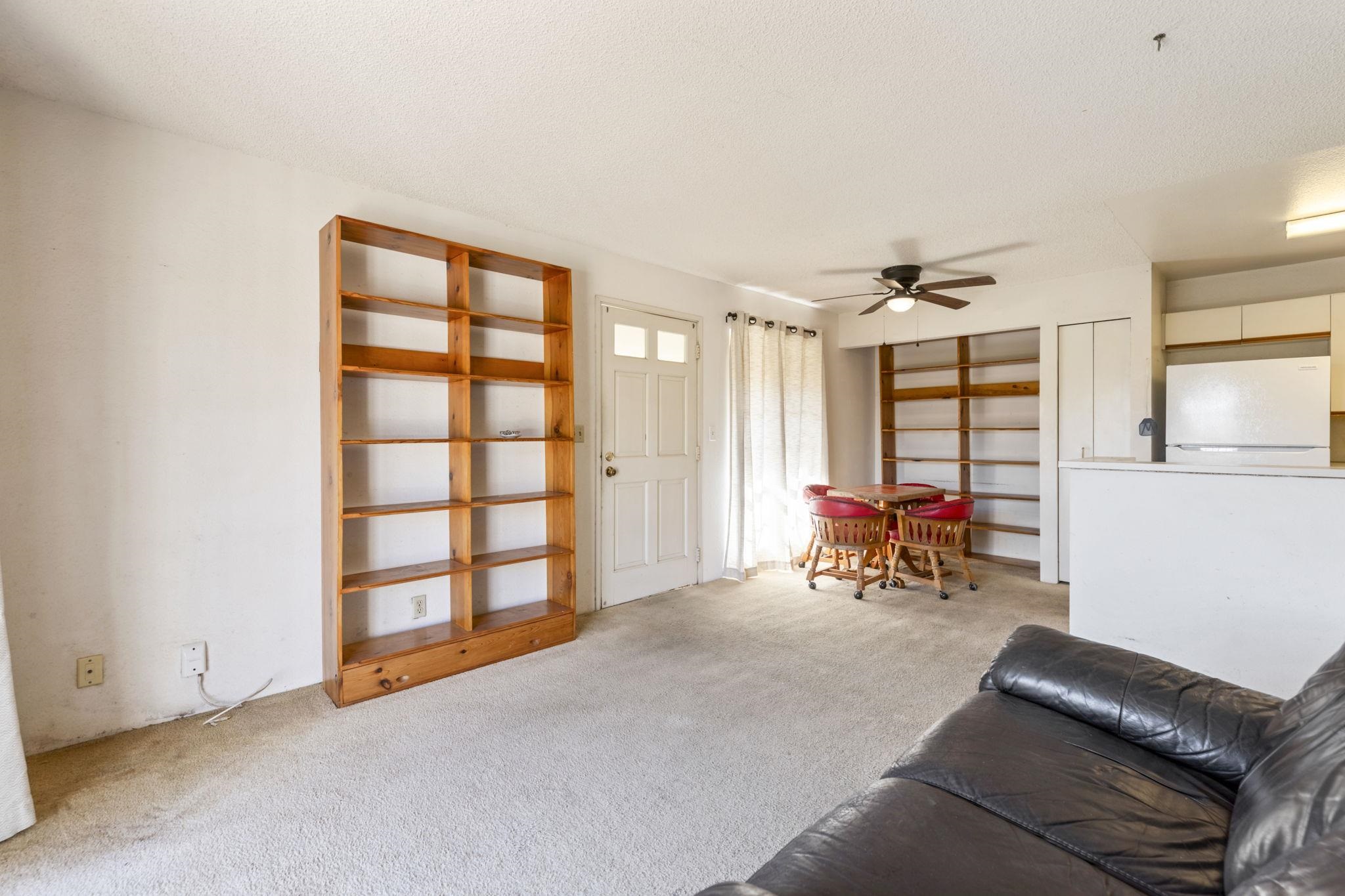140 Uwapo Road, Unit 18203 Kihei, HI 96753 - Photo 6 of 40 a view of a livingroom with a patio and a window