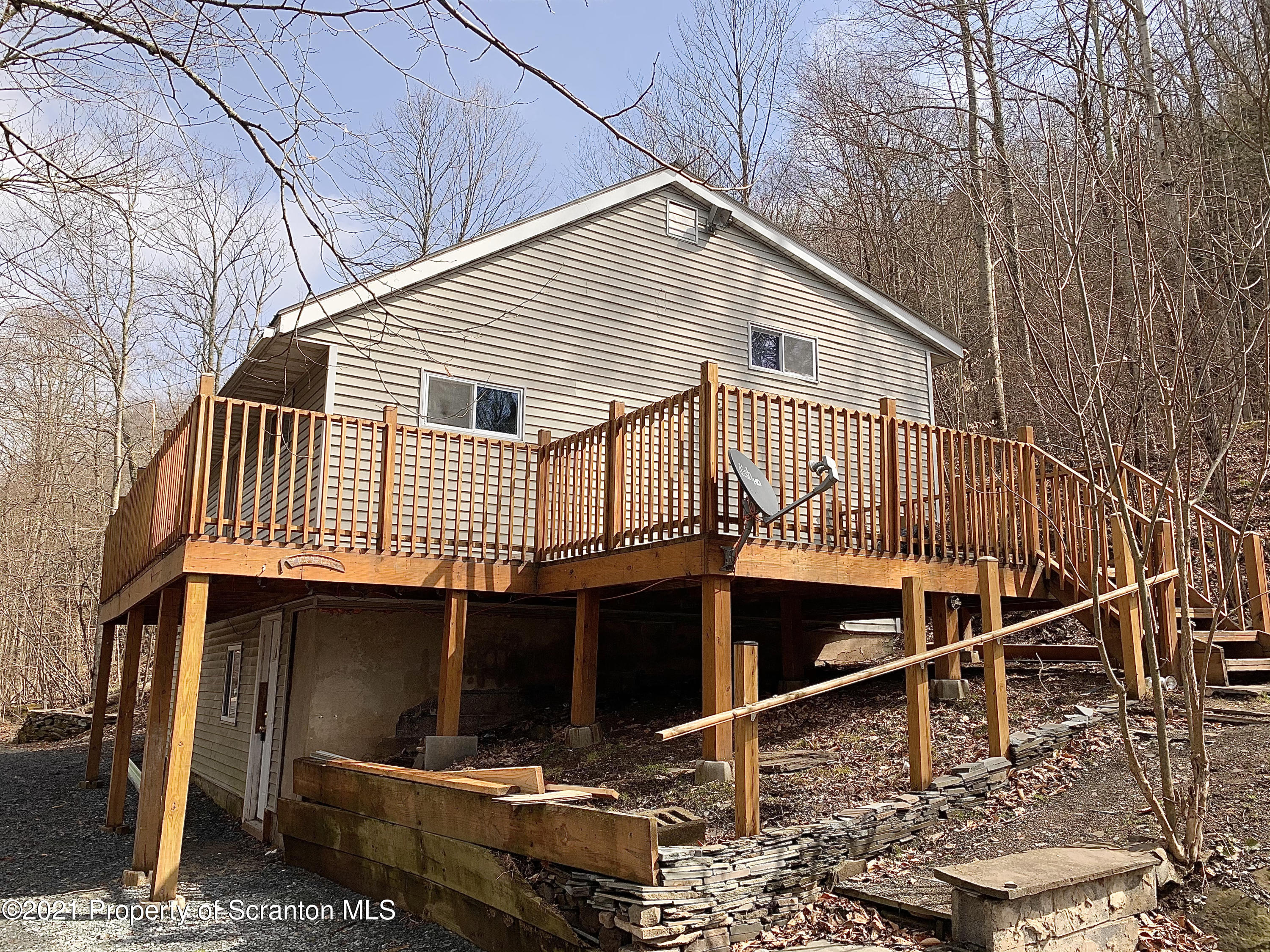 3886 Button Road Hop Bottom, PA 18824 - Photo 2 of 29 a view of a house with a balcony