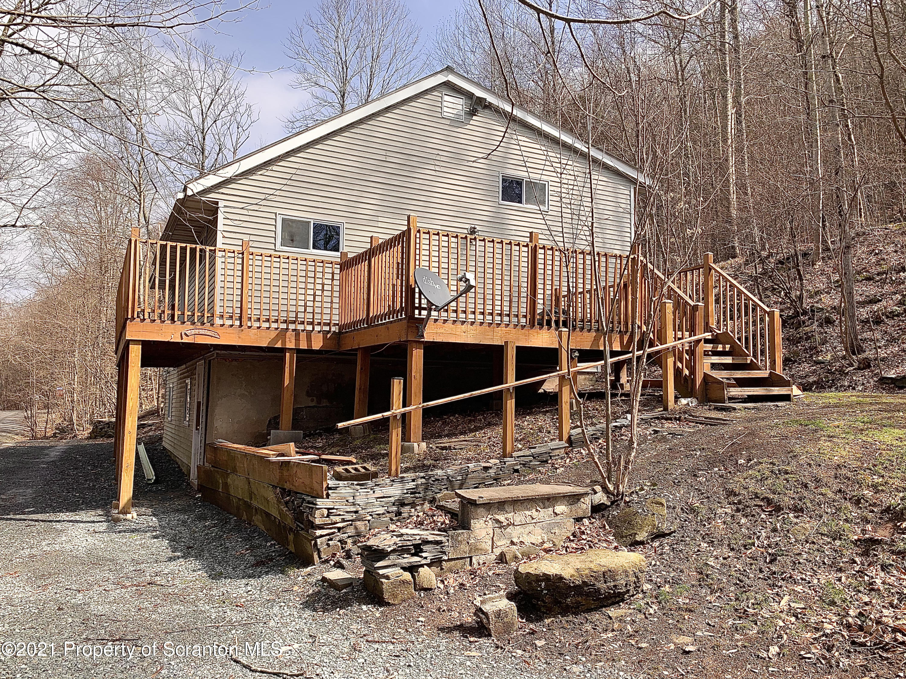 3886 Button Road Hop Bottom, PA 18824 - Photo 26 of 29 a backyard of a house with table and chairs