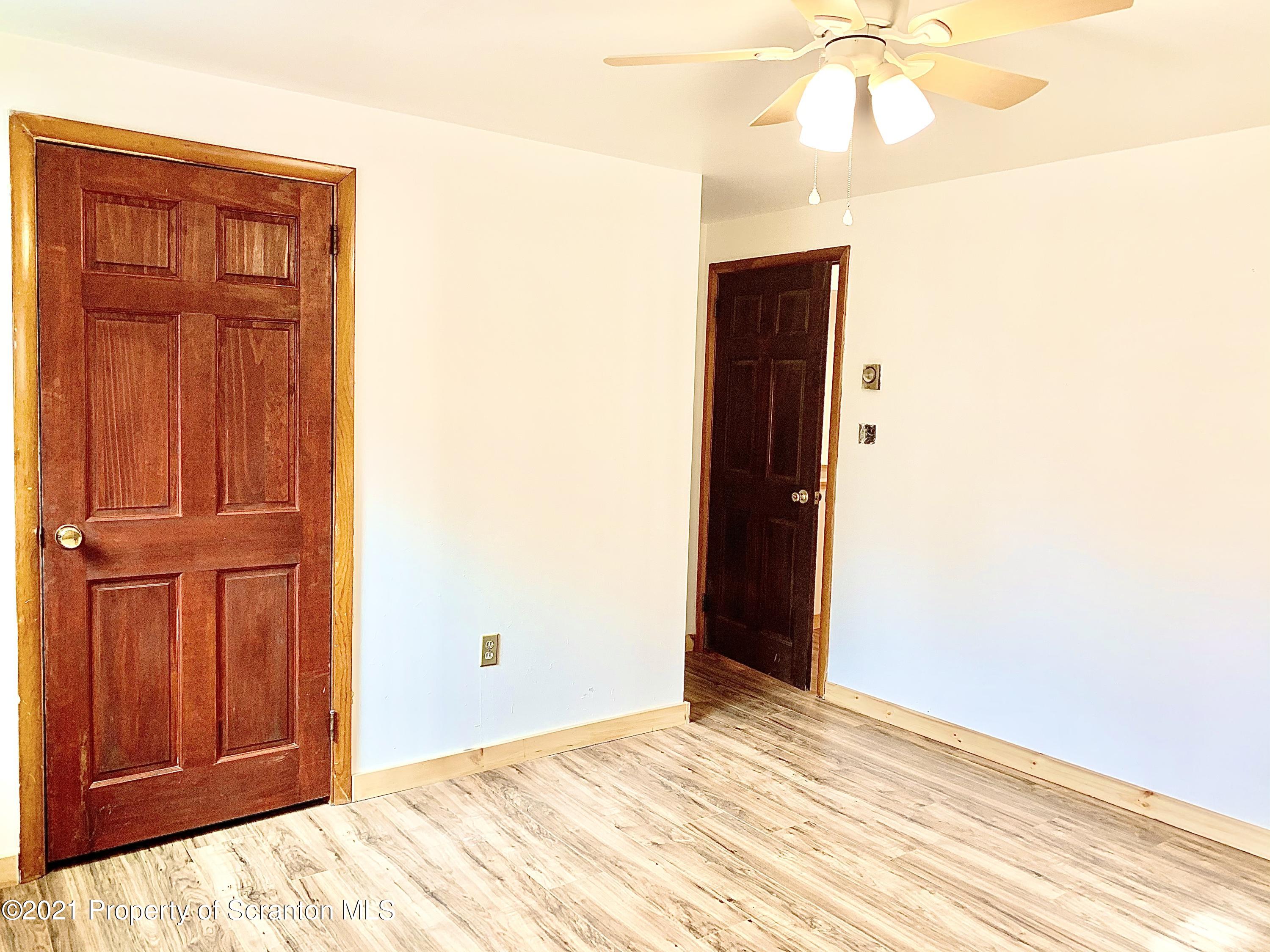 3886 Button Road Hop Bottom, PA 18824 - Photo 6 of 29 a view of a livingroom with an empty space