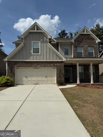 front view of a house with a garden