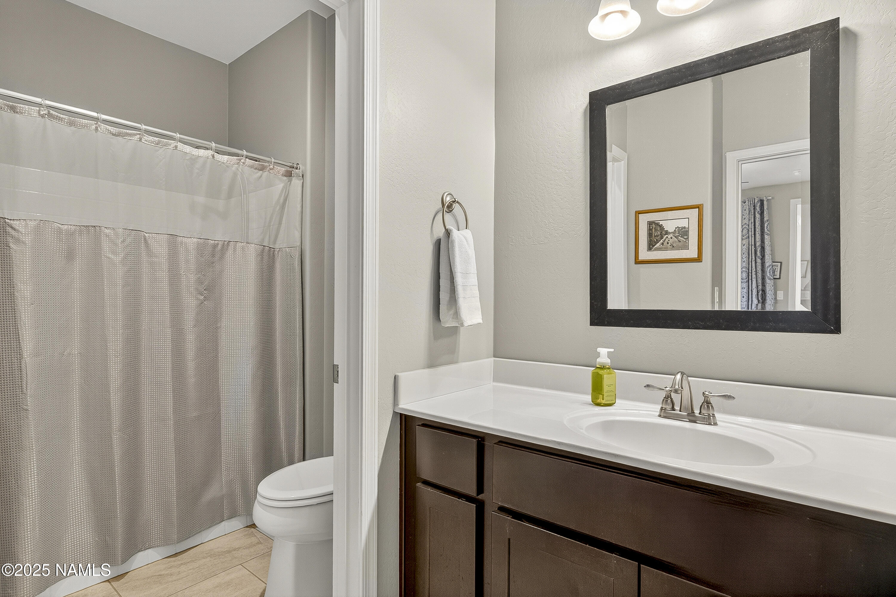 3143 East Cold Springs Trail Flagstaff, AZ 86004 - Photo 12 of 33 a bathroom with a sink and a mirror