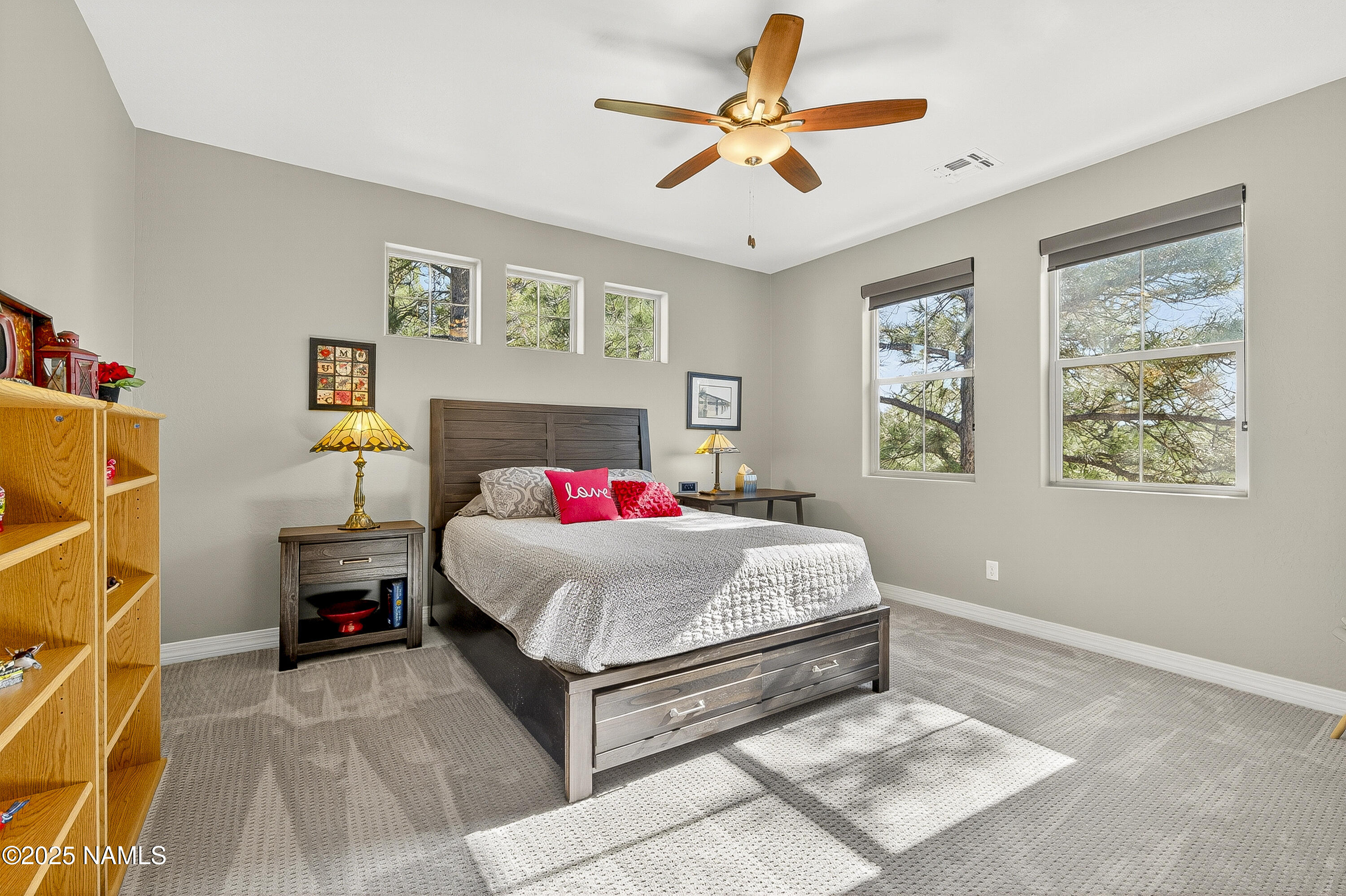 3143 East Cold Springs Trail Flagstaff, AZ 86004 - Photo 14 of 33 a bedroom with a bed and a chandelier