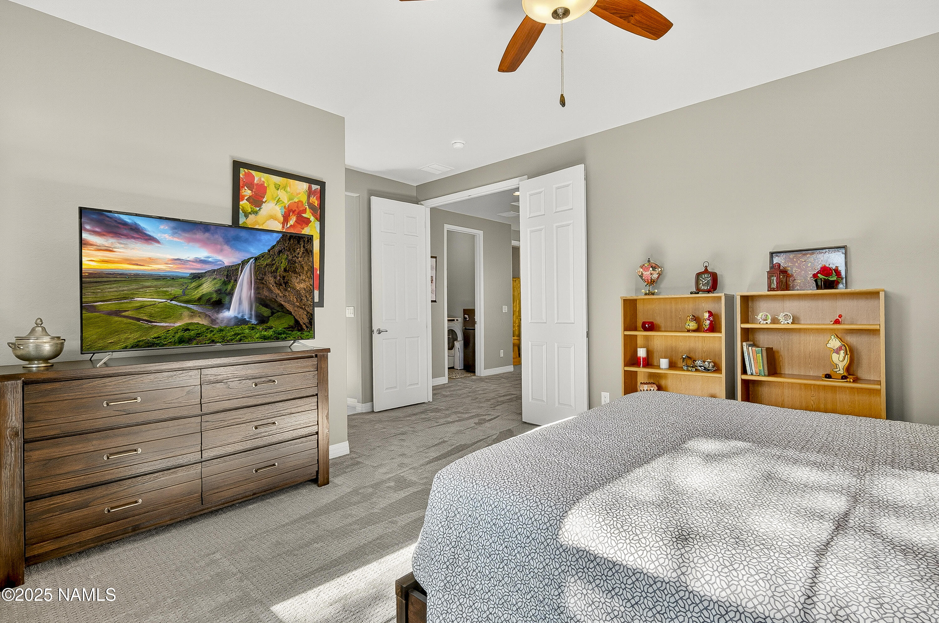 3143 East Cold Springs Trail Flagstaff, AZ 86004 - Photo 15 of 33 a bedroom with a bed and a flat screen tv