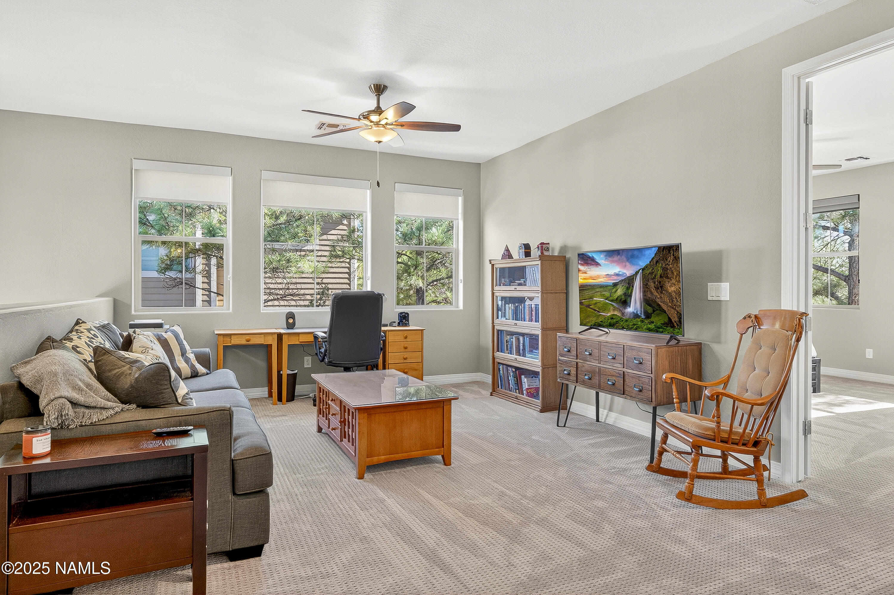 3143 East Cold Springs Trail Flagstaff, AZ 86004 - Photo 20 of 33 a living room with furniture and a flat screen tv