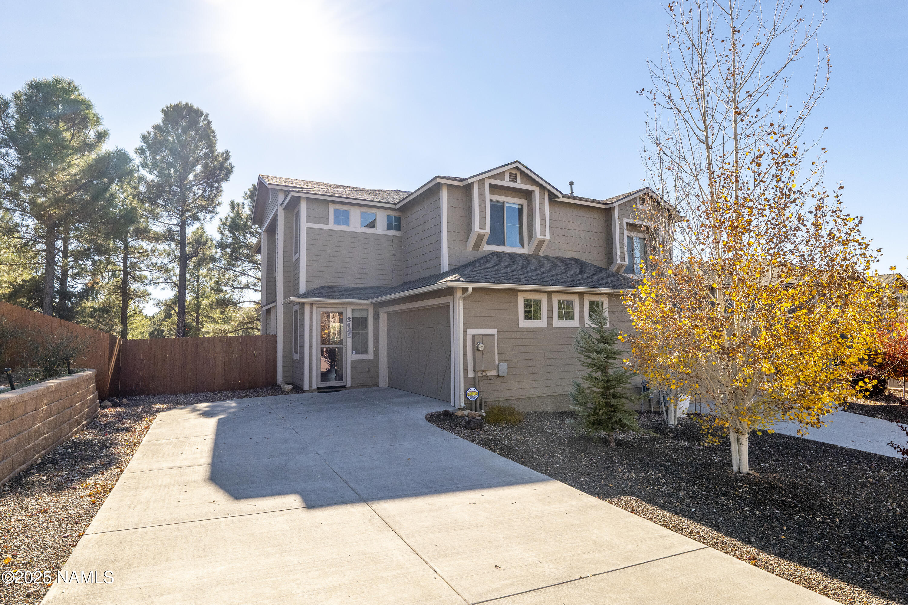 3143 East Cold Springs Trail Flagstaff, AZ 86004 - Photo 2 of 33 a front view of a house with a yard
