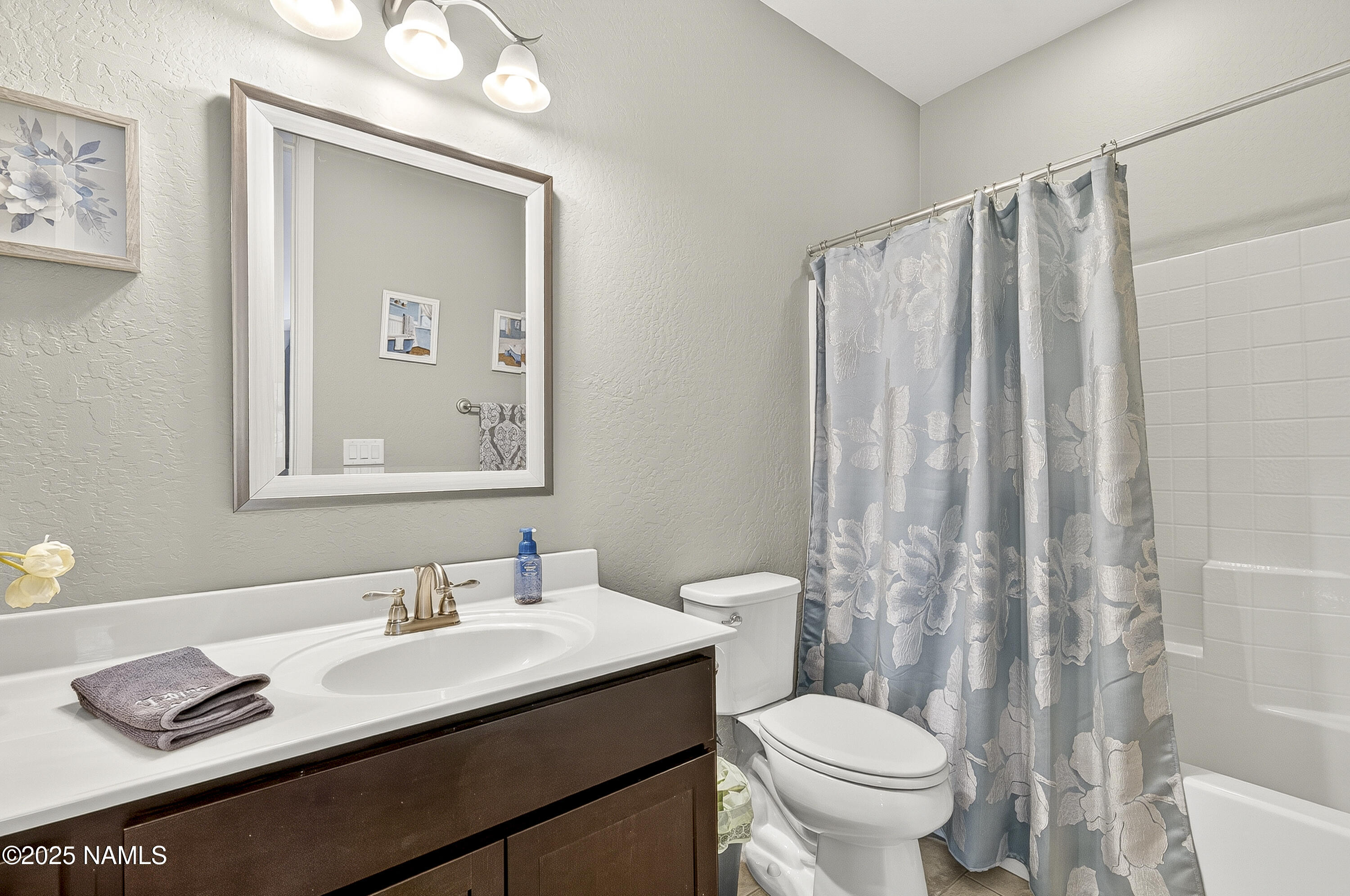 3143 East Cold Springs Trail Flagstaff, AZ 86004 - Photo 24 of 33 a bathroom with a granite countertop sink toilet and a mirror