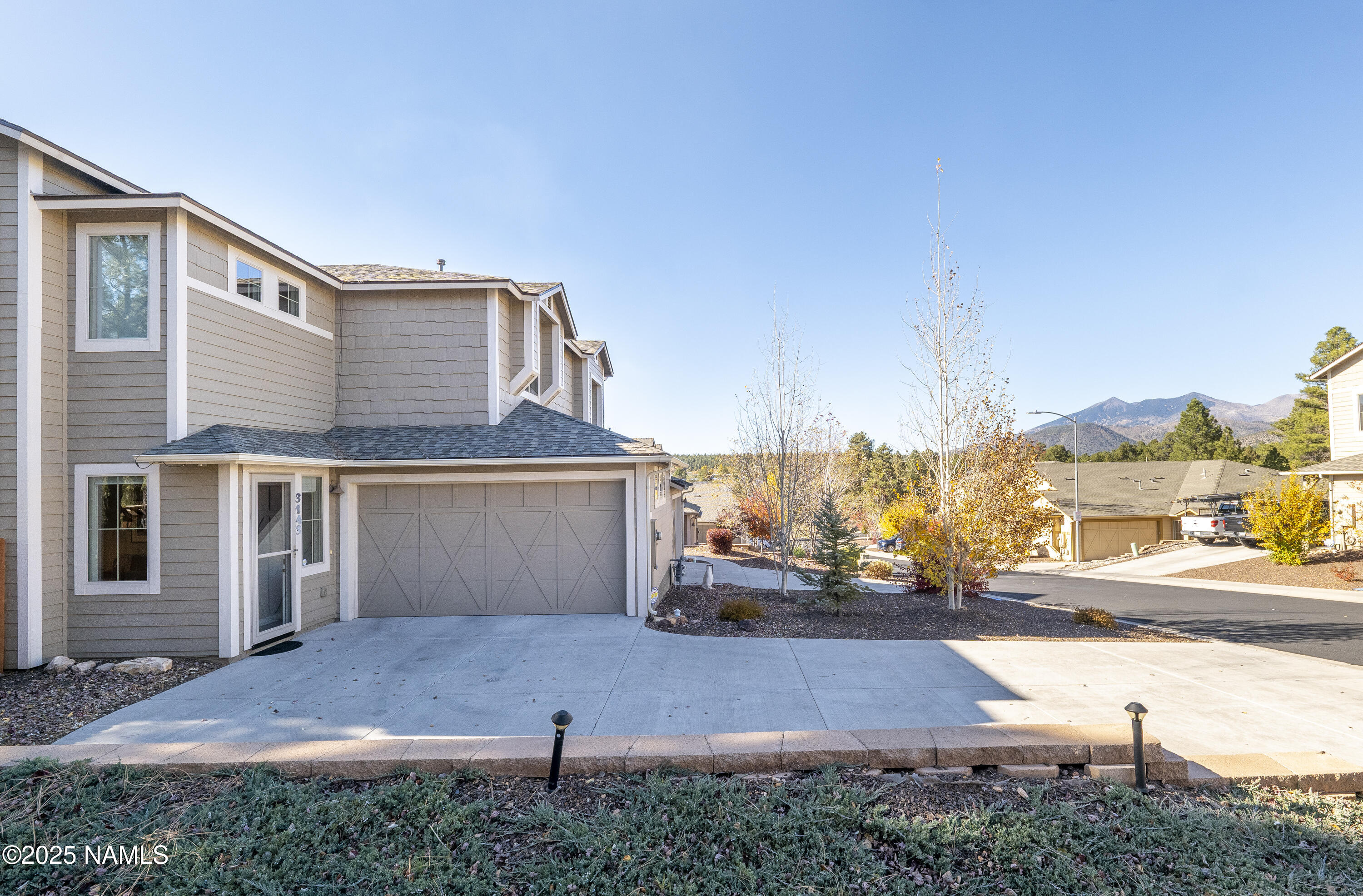 3143 East Cold Springs Trail Flagstaff, AZ 86004 - Photo 32 of 33 a front view of a house with a yard