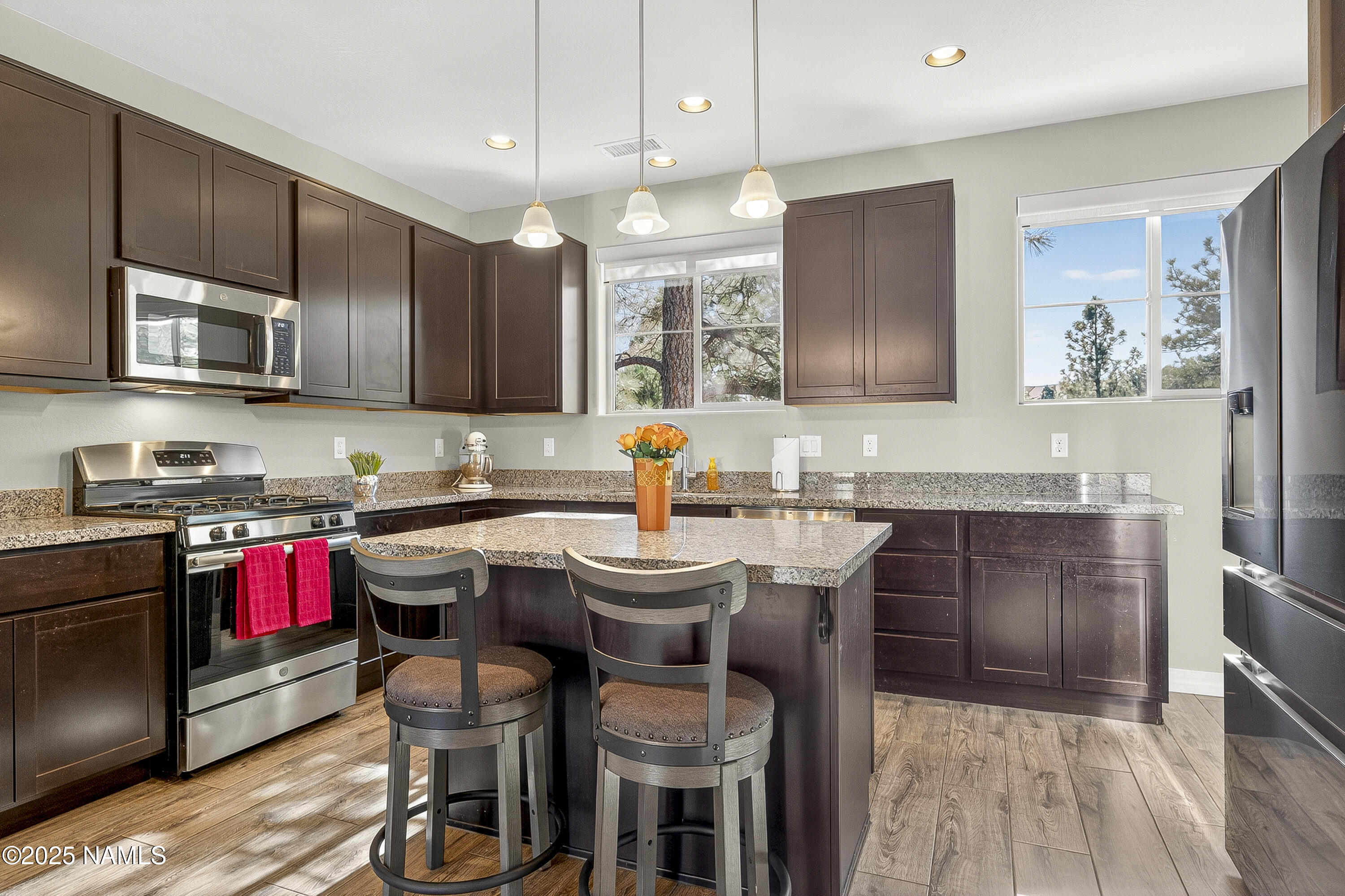 3143 East Cold Springs Trail Flagstaff, AZ 86004 - Photo 5 of 33 a kitchen with a sink stove and microwave