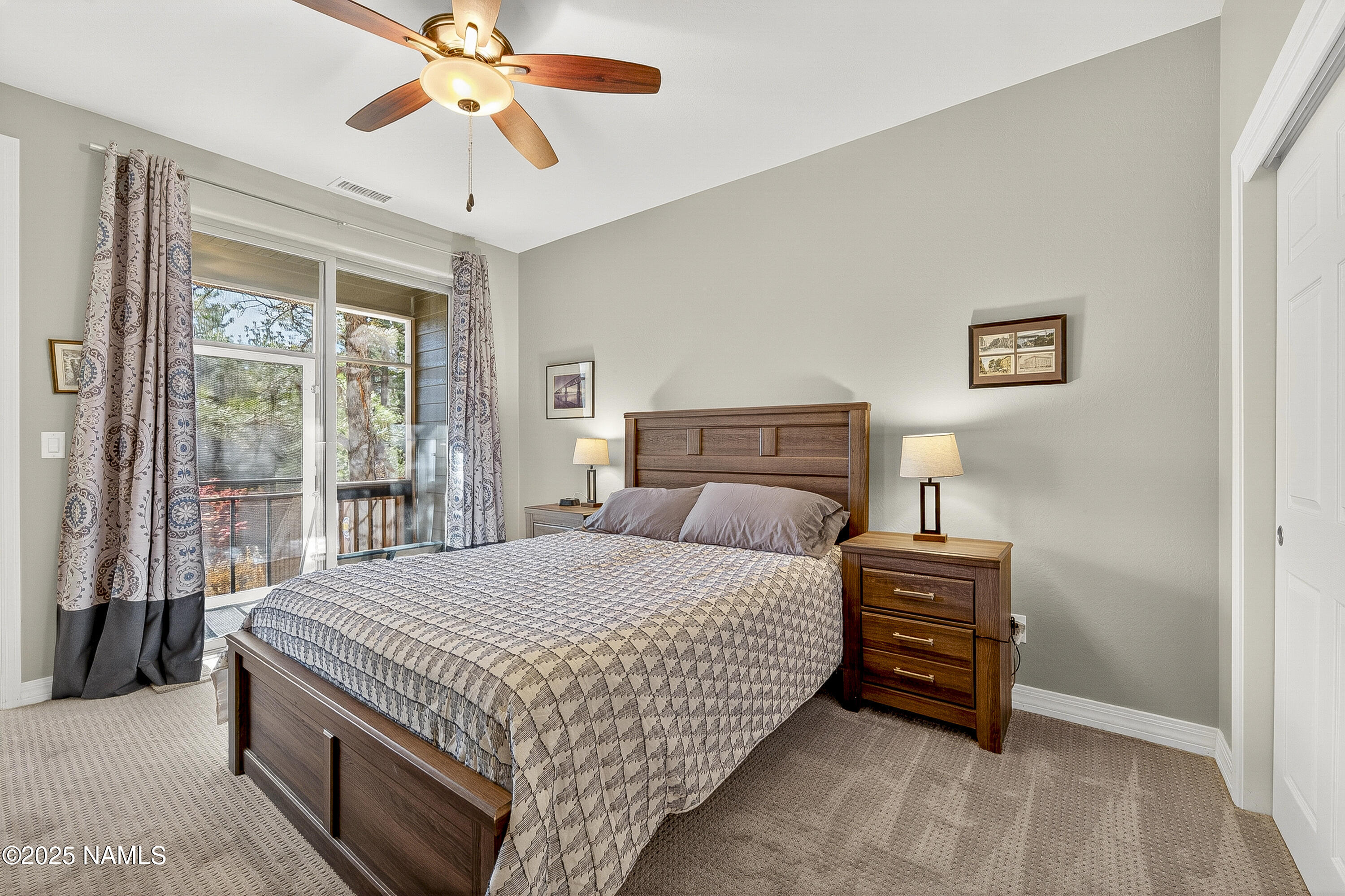 3143 East Cold Springs Trail Flagstaff, AZ 86004 - Photo 9 of 33 a bedroom with a bed and a chandelier