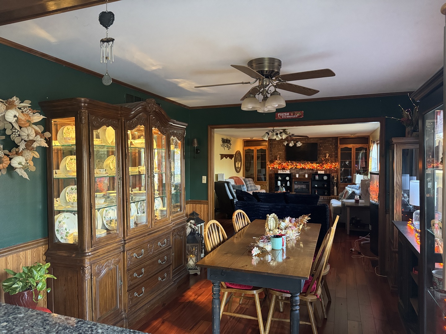 21 Colonial Drive Clinton, IL 61727 - Photo 17 of 40 a living room with furniture a chandelier and a floor to ceiling window