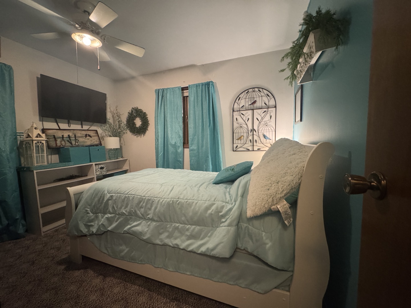 21 Colonial Drive Clinton, IL 61727 - Photo 28 of 40 a bedroom with a bed and a flat tv screen on the dresser