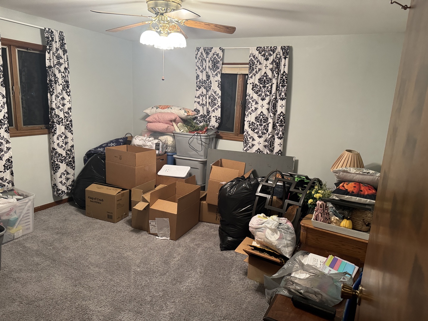 21 Colonial Drive Clinton, IL 61727 - Photo 31 of 40 a living room with furniture and a chandelier