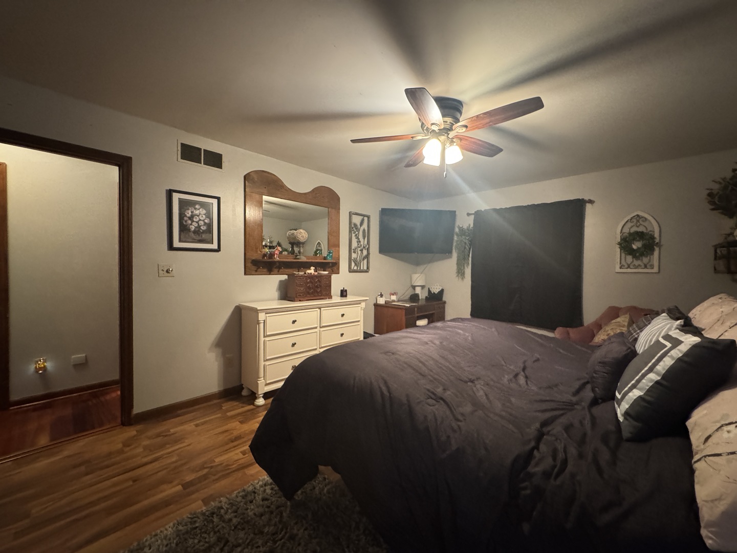 21 Colonial Drive Clinton, IL 61727 - Photo 35 of 40 a bedroom with a bed and a chandelier