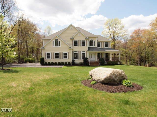 229 Fan Hill Road Monroe, CT 06468 - Photo 1 of 1 a front view of a house with a yard table and tree