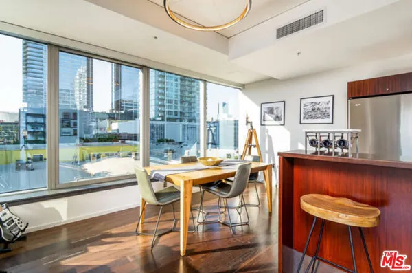 a view of a dining room with furniture window and outside view