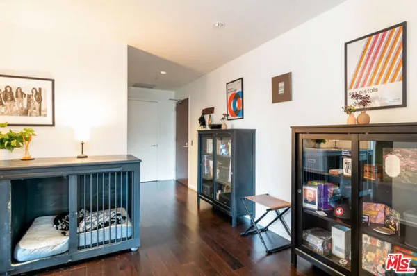 a bedroom with furniture and wooden floor