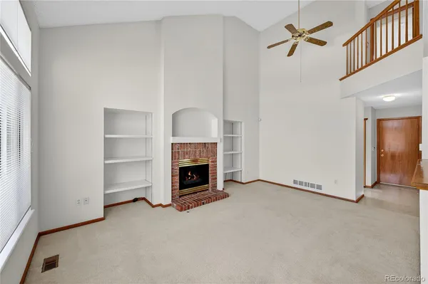 wooden floor and dining room in a hall with an empty room