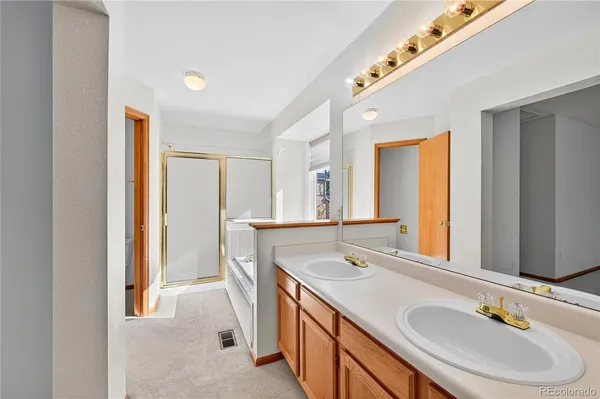 a bathroom with a glass shower door