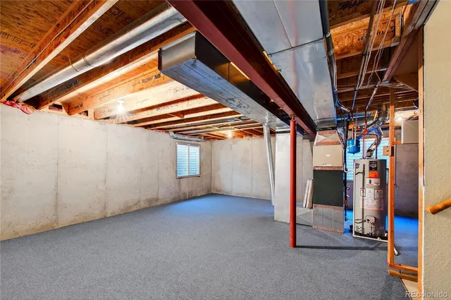 a view of a patio with table and chairs and wooden fence
